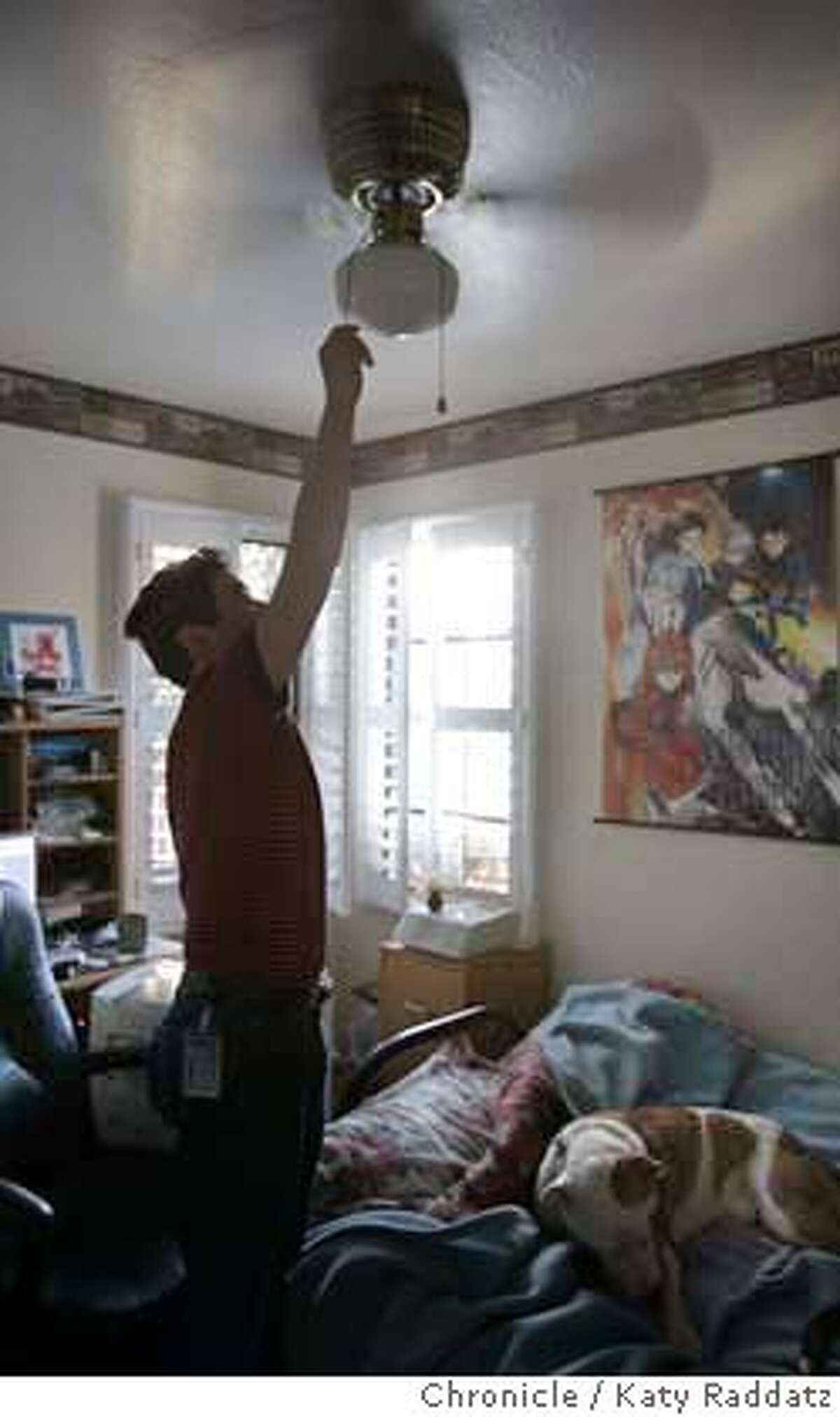 TOOHOT13058_rad.jpg SHOWN: Michael Santo invested $400 in an air conditioner for his office to keep the room and the computers cool. Here he's adding another layer of comfort: the ceiling fan. Story about excessive heat being a big issue for computer chip makers. (This is for a SECONDARY picture if needed). Katy Raddatz / The Chronicle MANDATORY CREDIT FOR PHOTOG AND SF CHRONICLE/ -MAGS OUT