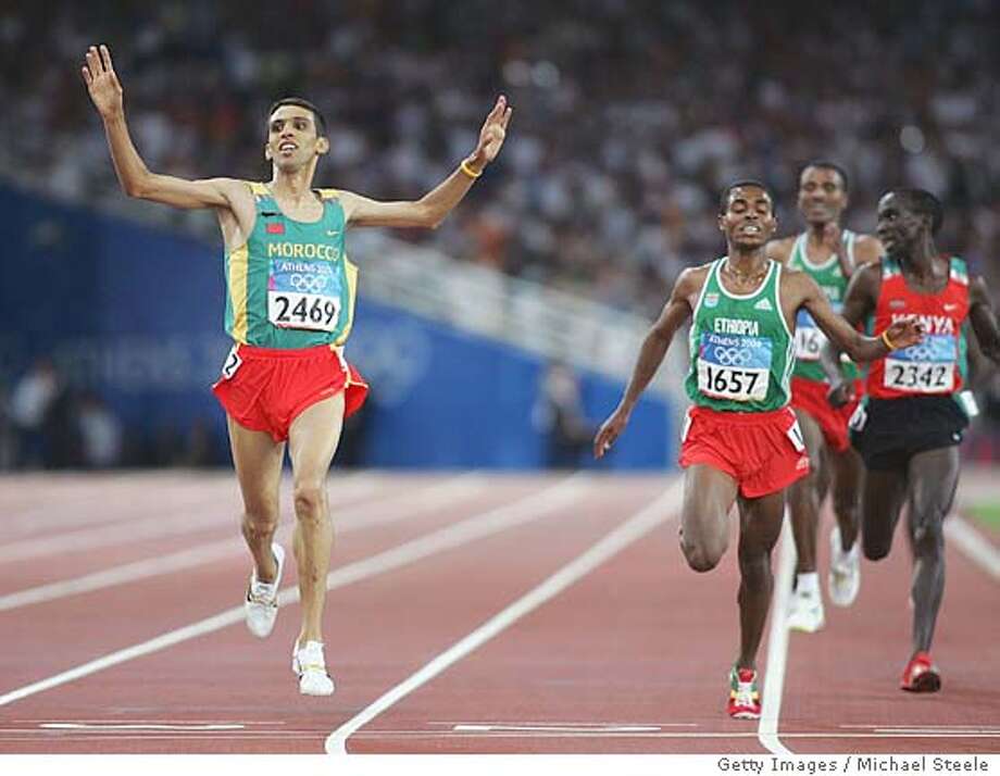 El Guerrouj Is Doubly Good Distance King Great Britain S Holmes Win Second Golds Sfgate