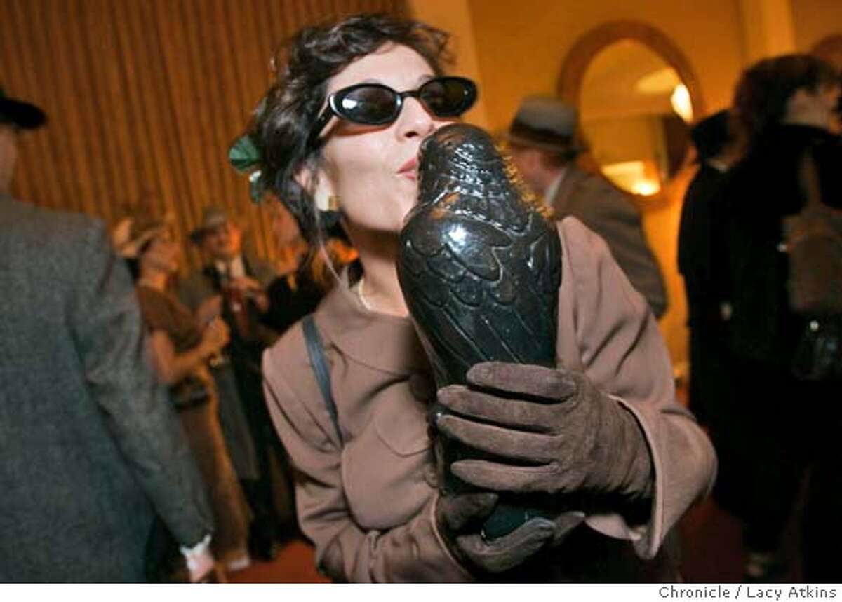 Melissa Panages gives the Falcon a kiss for luck at the dress-up contest, Thursday Feb.16, 2005, to celebrate for 75th anniversary, in San Francisco. This is a "Maltese Falcon" dress-up contest being staged by John's Grill for the 75th anniversary of the book's publication Photographer Lacy Atkins / San Francisco Chronicle