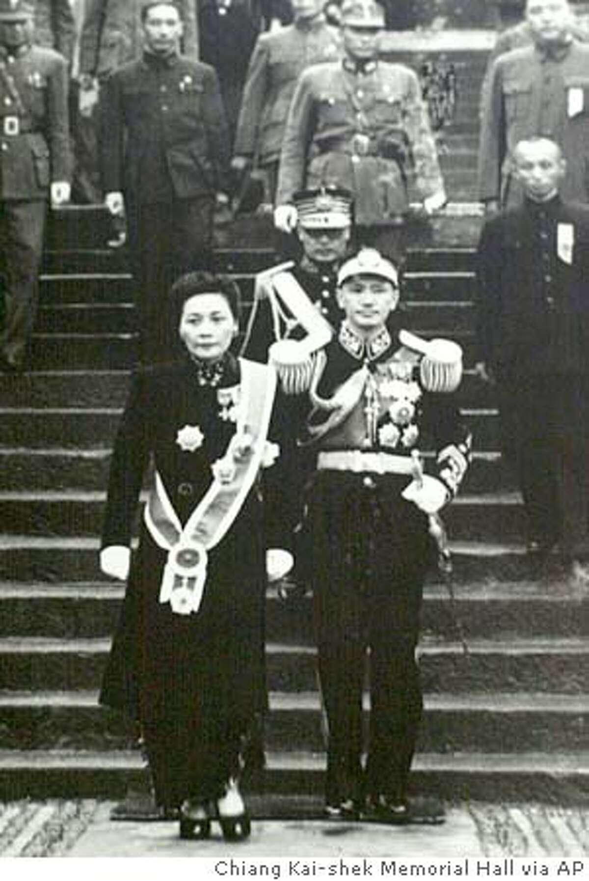 Madame Chiang Kai-shek, left, and Generalismo Chiang Kai-shek, leave an auditorium after Chiang Kai-shek assumed the post of chairman of the National Government, in this Oct. 10, 1943 photo, in China. Madame Chiang Kai-shek, famous for using her beauty, charm and fluent English to lobby Washington to help China fight the Japanese and later the Chinese Communists, died Thursday, Oct.23, 2003, in New York at age 105, Taiwan's Foreign Ministry said Friday. Details about the cause of death were not immediately available, the ministry spokesman Richard Shih said.(AP Photo Chiang Kai-shek Memorial Hall, HO) PHOTO TAKEN IN JULY 1943 A news rack outside a Stockton Street store displays a World Journal front-page story on the death of Madame Chiang Kai-shek. A news rack outside a Stockton Street store displays a World Journal front-page story on the death of Madame Chiang Kai-shek. CAT Metro#Metro#Chronicle#10/25/2003#ALL#5star##0421454137