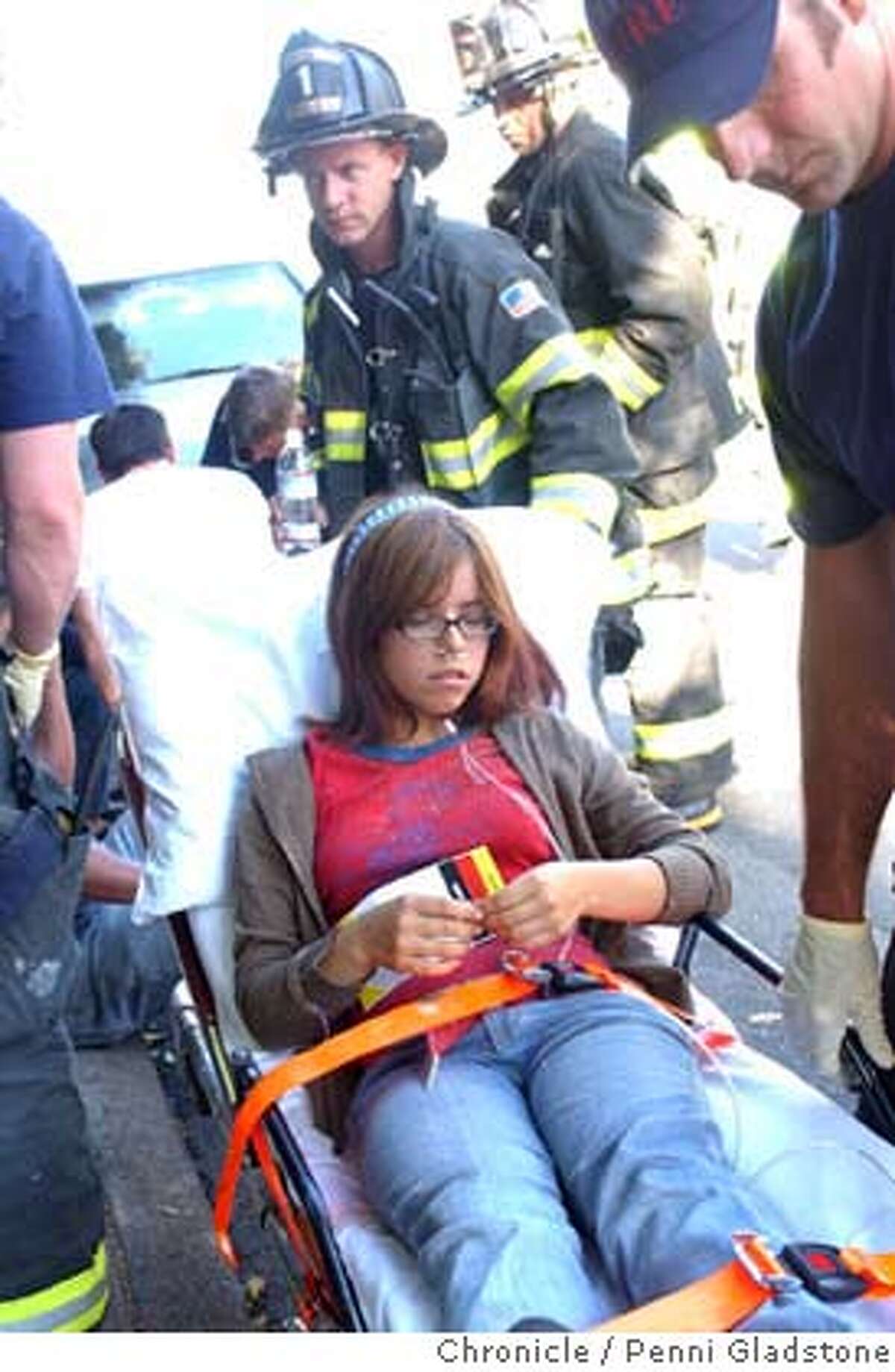 Zoe Mendez hurt in the theater goes to the hospital. Sequoia Theatre in Mill Valley was showing a matinee when part of the roof collapsed on the patrons who then ran out of the building covered in insulation. MV police and Sherriff and MV fire responded. About 33 people were in the theatre. 3 taken to hospital (ck) 8/16/04 in Mill Valley. Penni Gladstone / The Chronicle