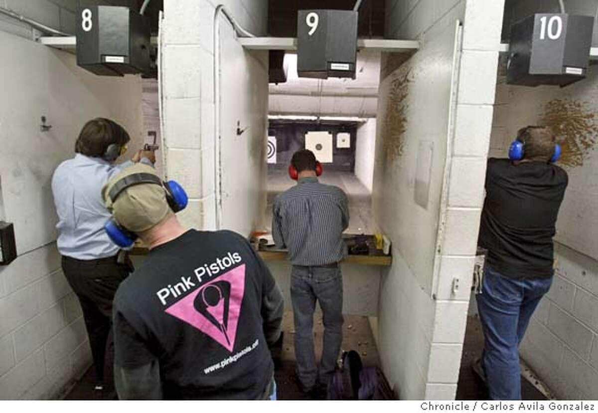 PISTOLS03_072_CAG.JPG Tom Boyer looks in on several members of the "Pink Pistols" as they do some target shooting at Jackson Arms Shooting Range in South San Francisco, Ca., on Tuesday, February 1, 2005. Against all stereotypes, this organization of gay men and lesbians advocates gun rights in San Francisco. They call themselves the Pink Pistols and they�ve found a new battle to fight now that the San Francisco supervisors want to make the city the second in the nation to ban the ownership of handguns. Photo by Carlos Avila Gonzalez / The San Francisco Chronicle Photo taken on 2/1/05 in South San Francisco, CA. MANDATORY CREDIT FOR PHOTOG AND SAN FRANCISCO CHRONICLE/ -MAGS OUT