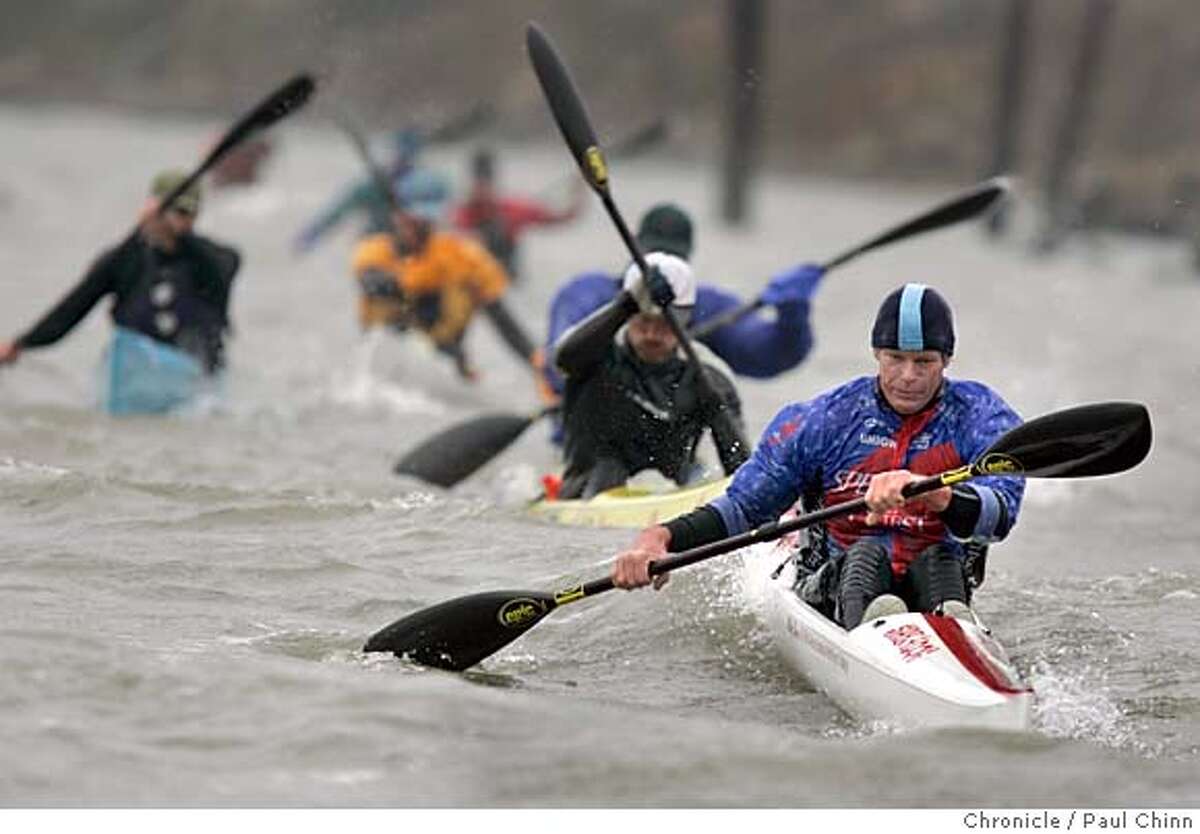 paddlers27_170_pc.jpg Mike Shea leads a pack of paddlers on the long race course. The Wavechaser series of outrigger canoe races on 1/22/05 in Benicia, CA. PAUL CHINN/The Chronicle MANDATORY CREDIT FOR PHOTOG AND S.F. CHRONICLE/ - MAGS OUT