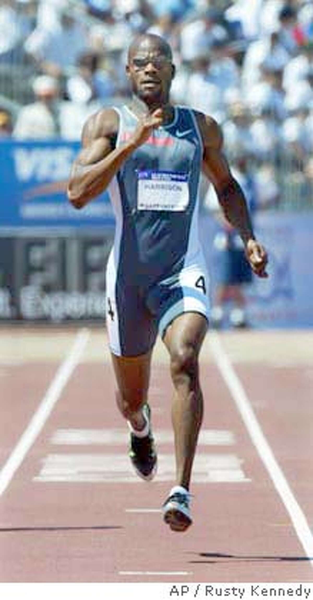 ** FILE ** Calvin Harrison in action during the men's 400 meter qualifying dash at the U.S. Olympic track and field trials in Sacramento, Calif., in this July 11, 2004 file photo. Harrison was suspended Monday, Aug. 2, 2004 for two years for a second doping violation, making him ineligible for the Athens Olympics. The U.S. Anti-Doping Agency said Harrison tested positive for the prohibited stimulant modafinil at the USA Outdoor Track & Field Championships at Stanford, Calif. on June 21, 2003. (AP Photo/Rusty Kennedy)