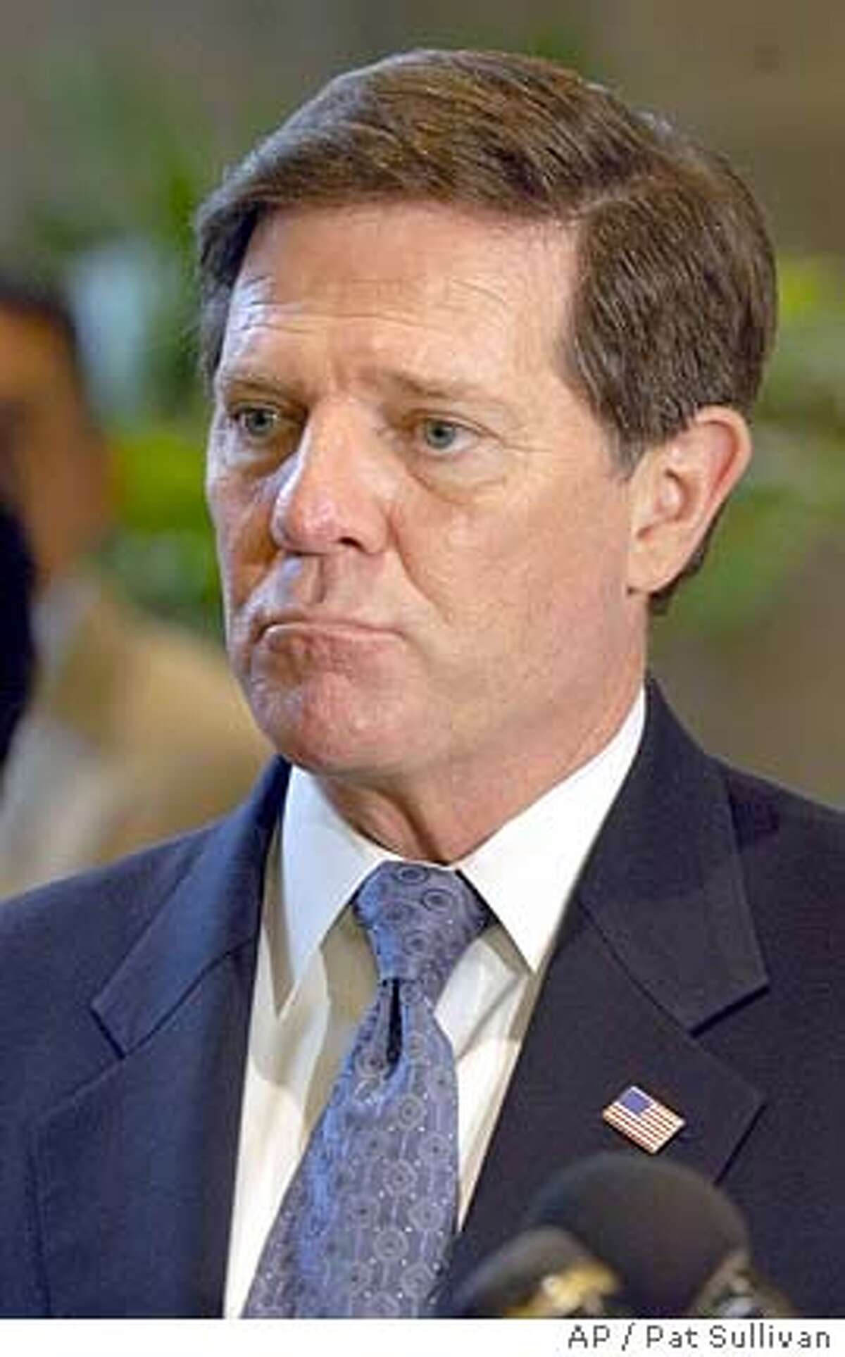 **FILE**House Majority Leader Tom DeLay ponders a question during a press conference in Houston in this Oct. 22, 2004 file photo. House Republicans suddenly reversed course Monday, Jan. 3, 2005 deciding to retain a tough standard for lawmaker discipline and reinstating a rule that would force Majority Leader Tom DeLay to step aside if indicted by a Texas grand jury. (AP Photo/Pat Sullivan) FILE