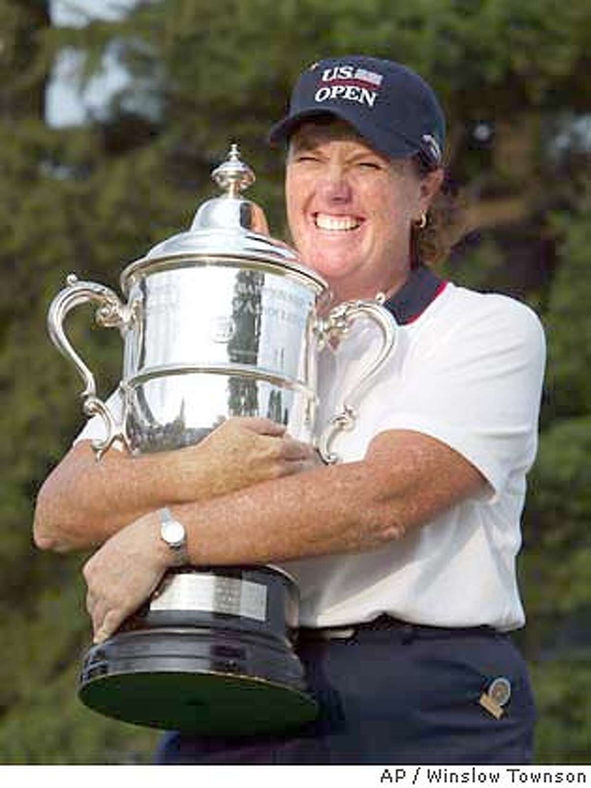 Meg Mallon holds the trophy after winning the U.S. Women's Open at The Orchards Golf Club in South Hadley, Ma. Sunday, July 4, 2004 with a score of 10-under par 274. (AP Photo/Winslow Townson)