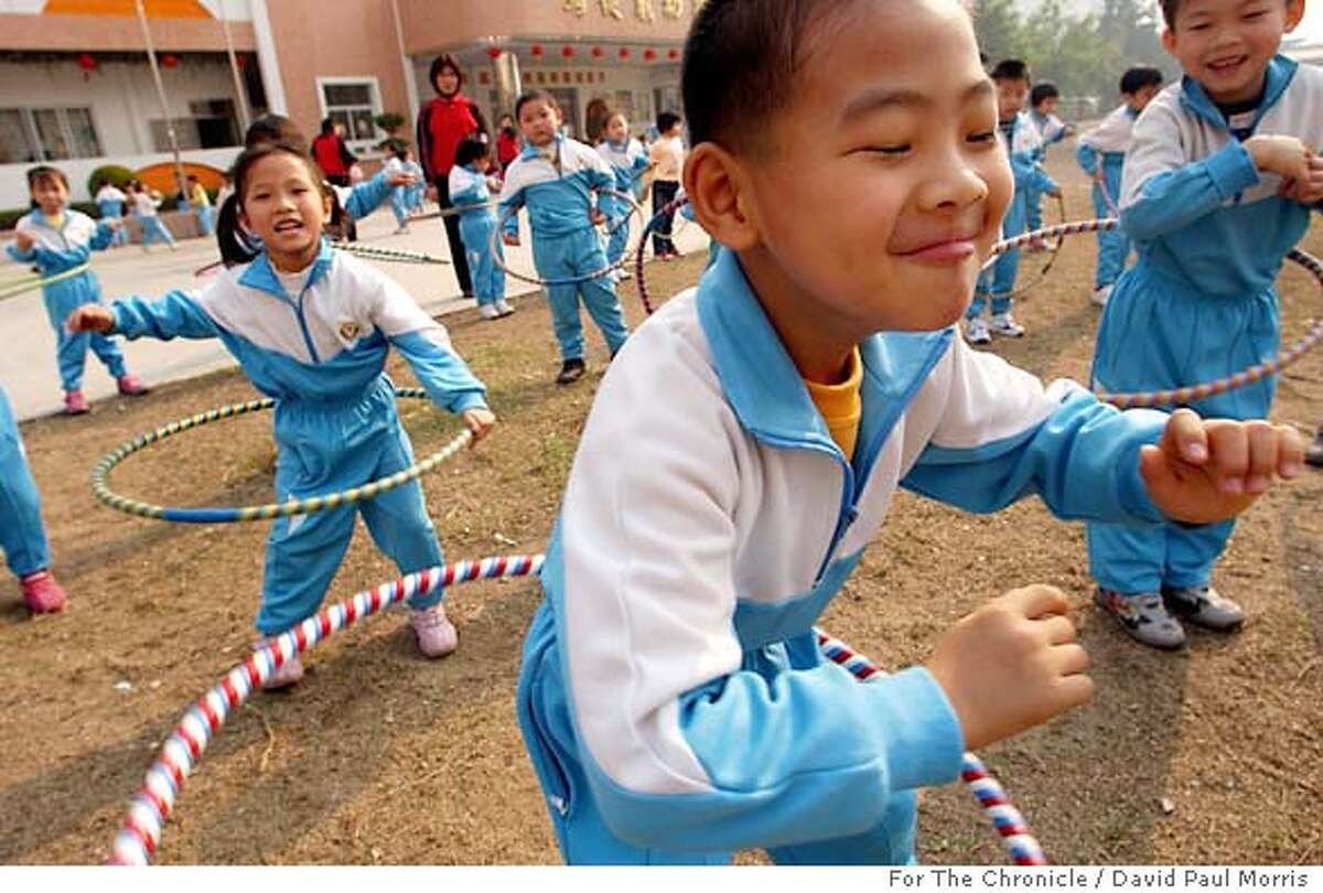 Children exercise outside a preschool San Francisco businessman Hong Mah built in his native China to give back to his homeland. Photo by David Paul Morris, for the Chronicle