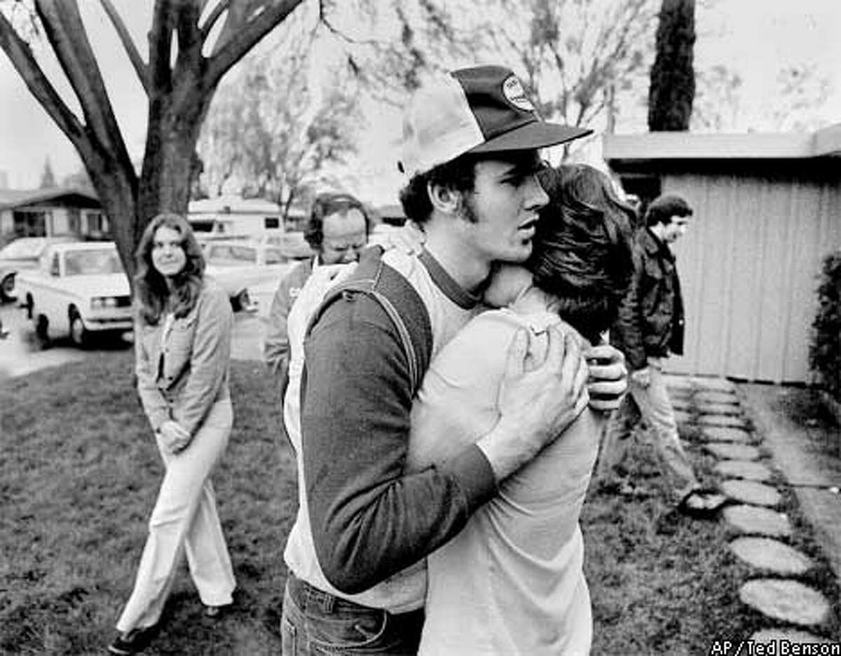 Cary Stayner, shown in this March 2, 1980, file photo, is hugged by his mother Kay Stayner outside the Stayner home in Merced County, Calif., on the day Stayner's brother Steven was reunited with his family after being kidnapped for 7 years. (AP Photo/The Modesto Bee, Ted Benson)