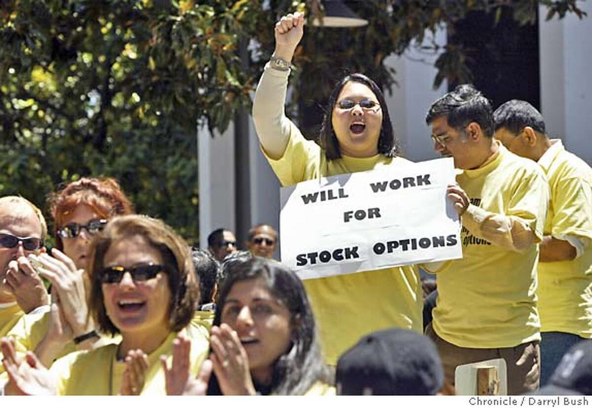 Debbie Tsoi-A-Sue who manages the stock administration department at Sun Microsystems in Santa Clara, holds a sign that reads, "Will Work For Stock Options," as she cheers at a rally of tech workers at Palo Alto City Hall to protest the FASB possible actions to set accounting rules that would force companies to make stock options an expense. Event on 6/24/04 in Palo Alto. Darryl Bush / Chronicle