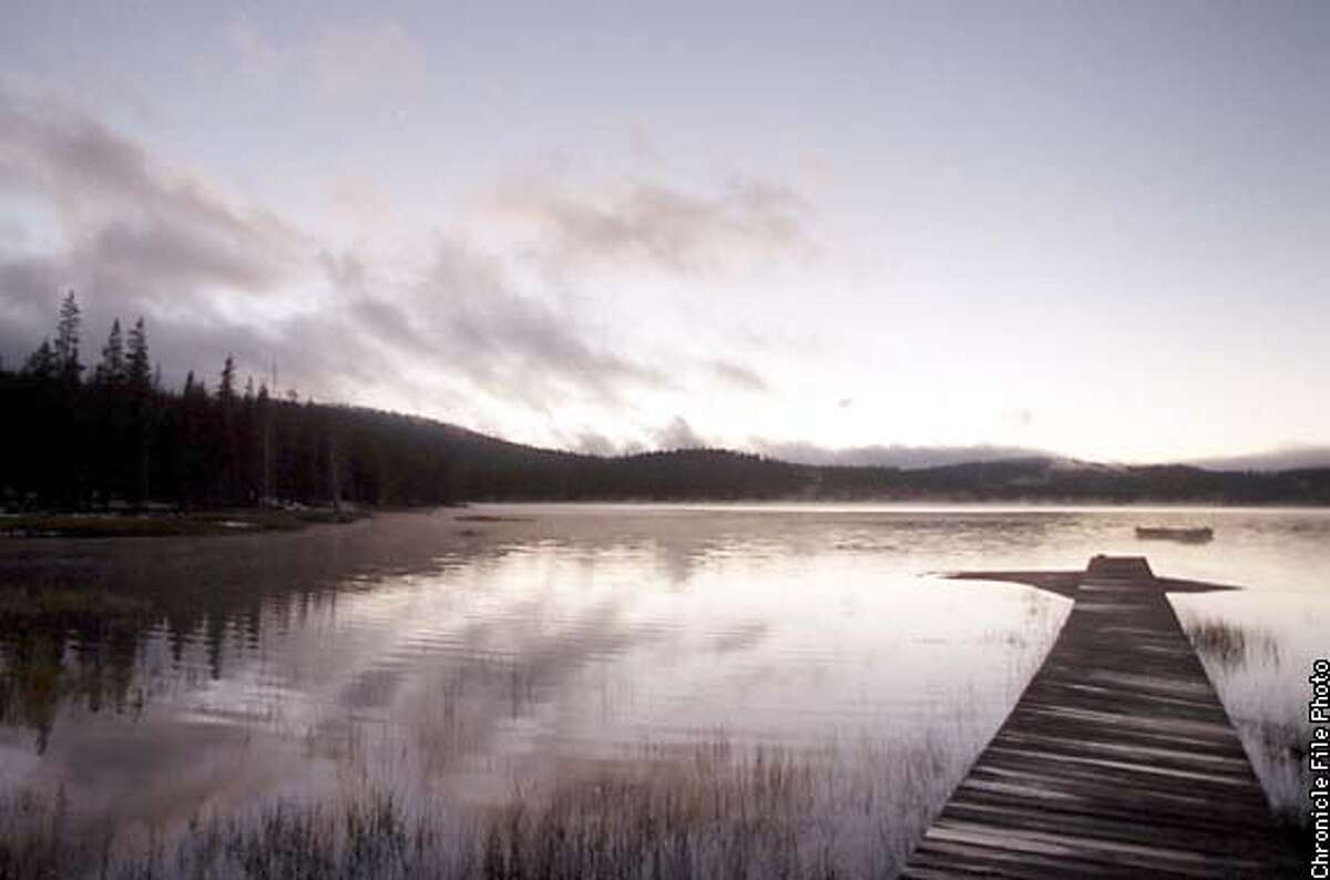 A small boat dock jets out into the waters of Medicine Lake. This was shot 10/25/98. Brad Garrison