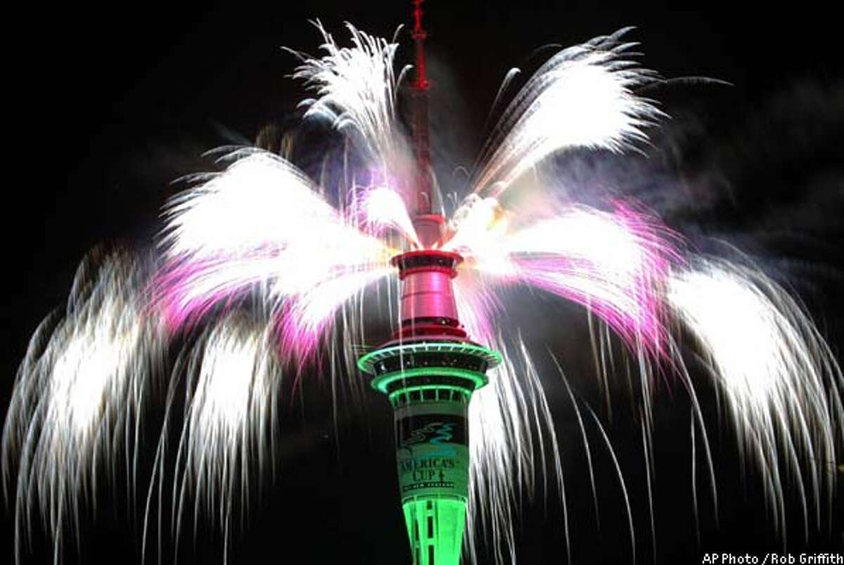 The Sky Tower in Auckland, New Zealand, explodes in a flurry of fireworks at the stroke of midnight Wednesday, Jan. 1, 2003. (AP Photo/Rob Griffith)