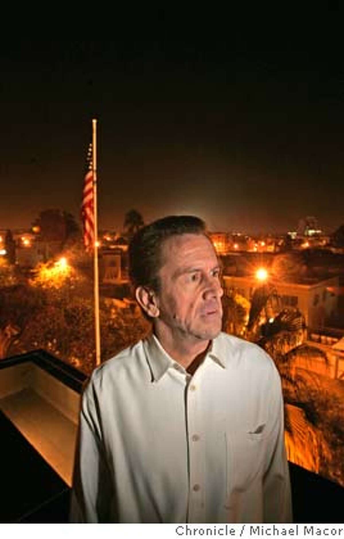 The Ambassador on the roof of his residence, overlooking downtown Rabat. The US Ambassador in Morocco, Thomas Riley, hosts a holiday party for Embassy workers a week before Christmas. Ambassador's residence in Rabat. 12/18/04 Rabat, Morocco Michael Macor / San Francisco Chronicle