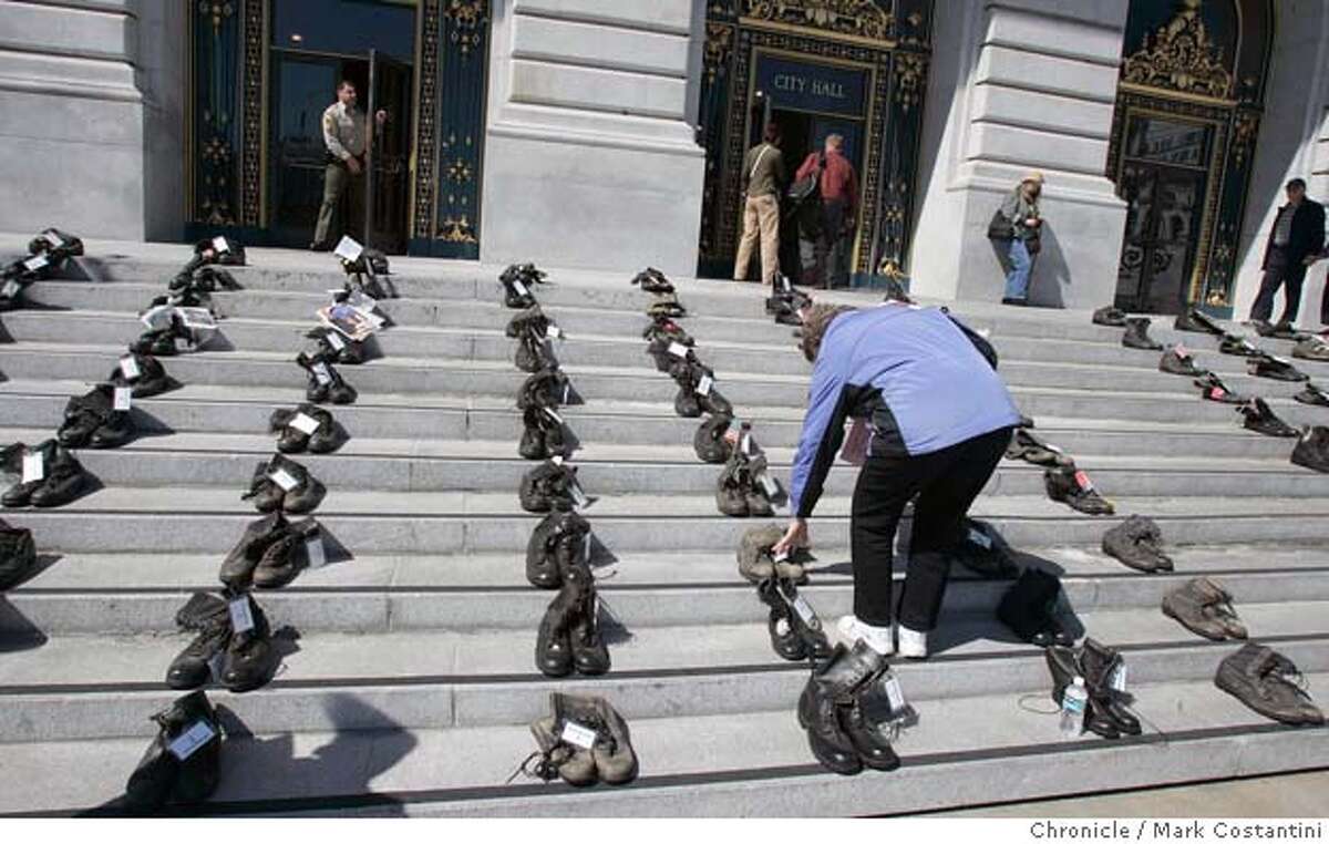 SAN FRANCISCO / Empty boots are silent testament to war's toll / Each
