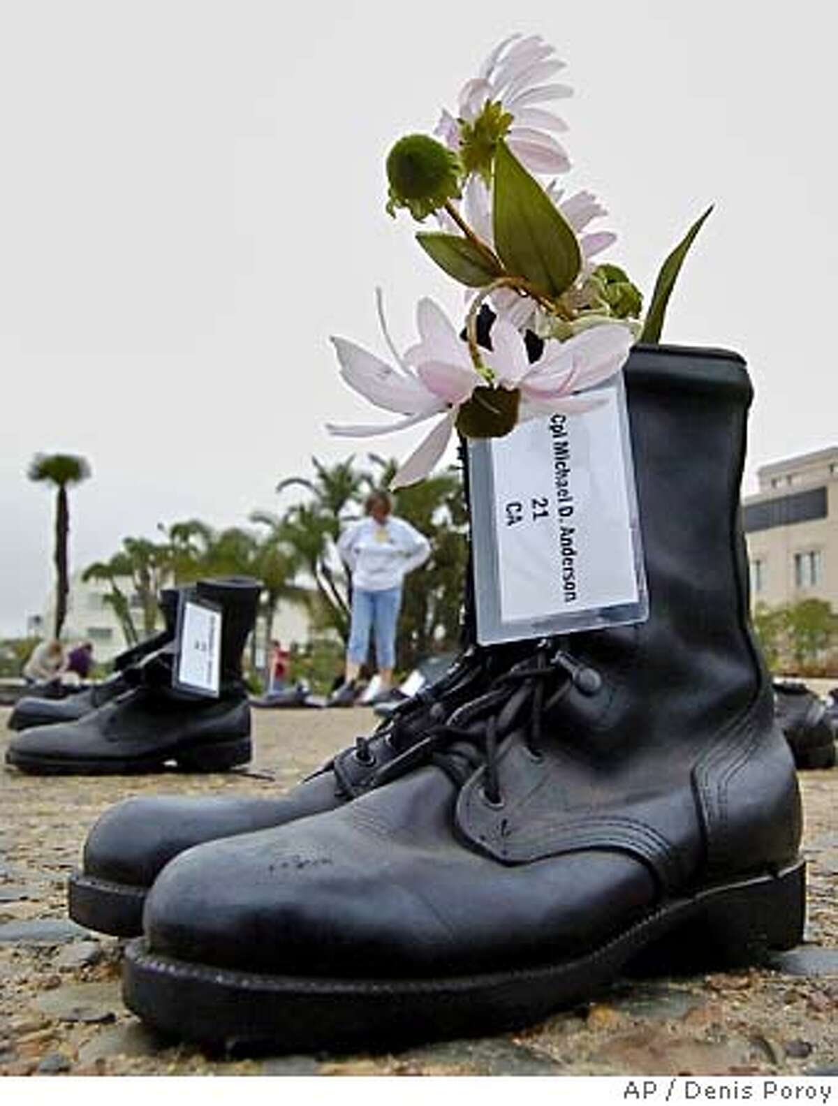 SAN FRANCISCO / Empty boots are silent testament to war's toll / Each ...