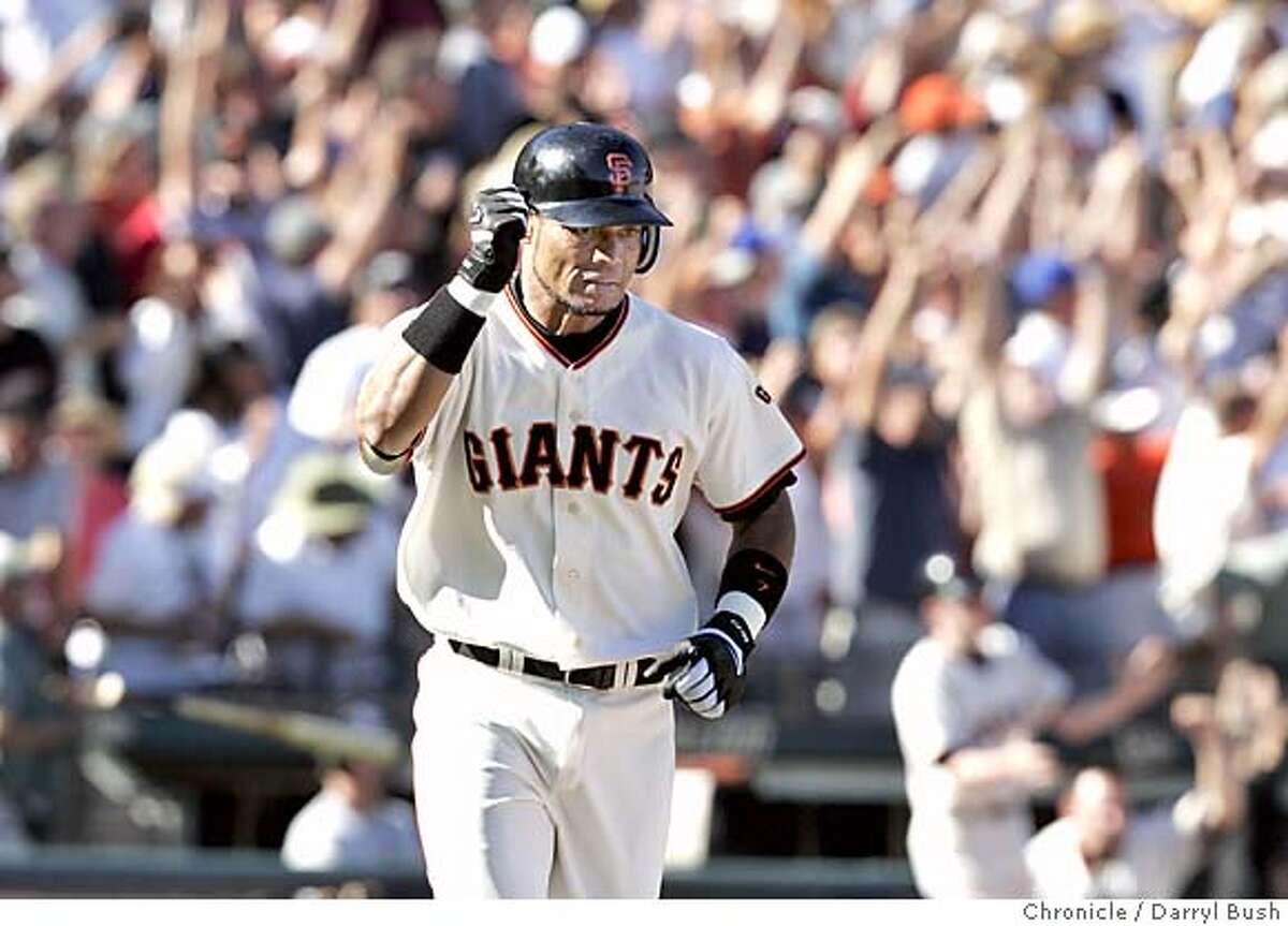 giants26_003_db.jpg San Francisco Giants Pedro Feliz raises his fist while running after he hit a grand slam home run vs. the Los Angeles Dodgers in the eighth inning at SBC Park. 9/25/04 in San Francisco Darryl Bush / The Chronicle Ran on: 01-18-2005 Brandy Hazelett at her spot on Van Ness and Golden Gate MANDATORY CREDIT FOR PHOTOG AND SF CHRONICLE/ -MAGS OUT