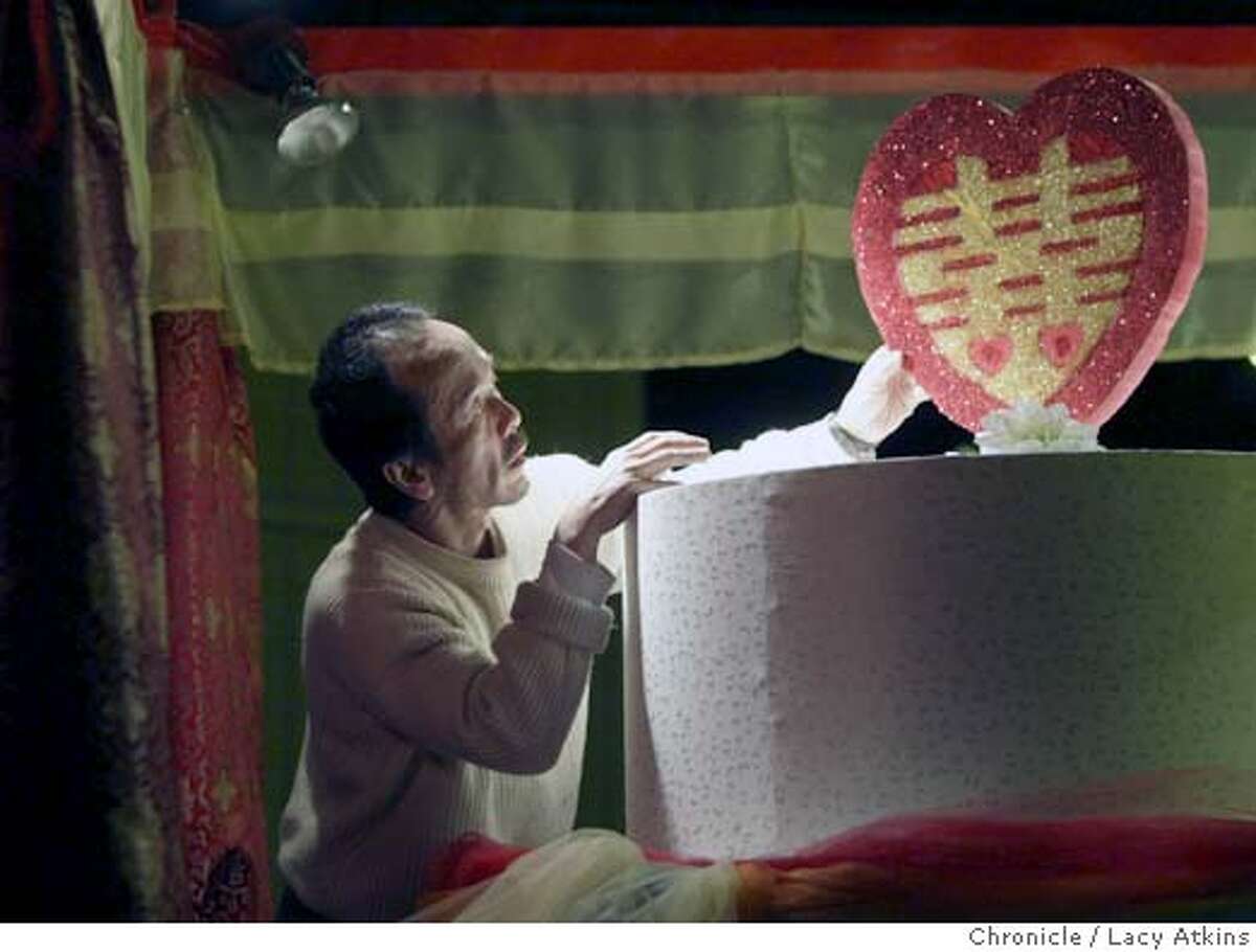 Kek Tee Lim places the double paradise heart on the same-sex marriage float, Tuesday Feb.15, 2005, in preparation of the Chinese New Year parade,in San Francisco.For the first time in history, there is going to be a same-sex marriage float in the Chinese New Year Parade. Photographer Lacy Atkins / San Francisco Chronicle