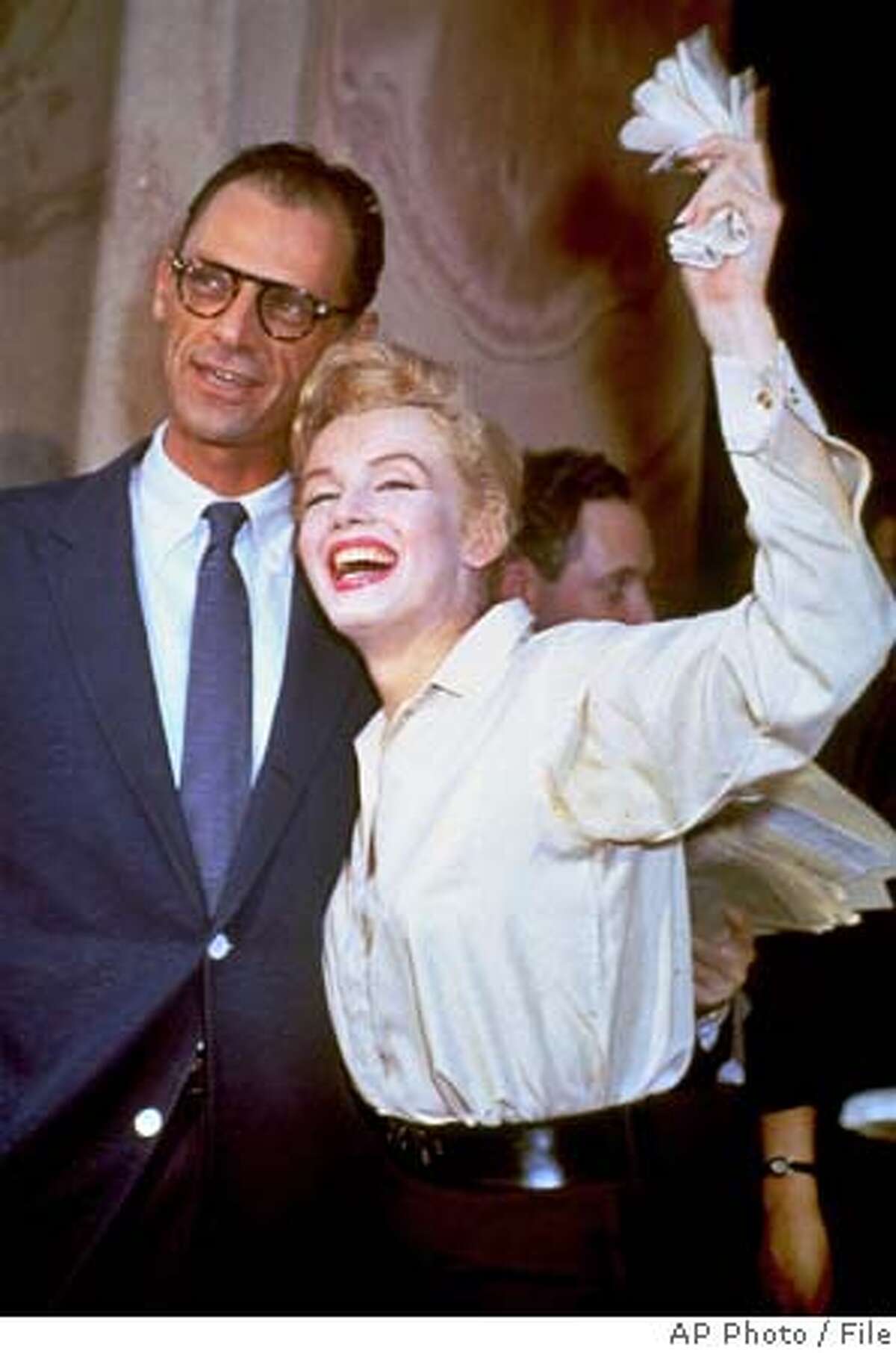 **FILE**Newlyweds Marilyn Monroe and Arthur Miller are shown after their civil wedding ceremony in White Plains, N.Y., on June 29, 1956. Miller, the Pulitzer prize-winning playwright whose most famous fictional creation, Willy Loman in "Death of a Salesman," came to symbolize the American Dream gone awry, has died, his assistant said Friday, Feb. 11, 2005. He was 89. Miller died Thursday evening, said his assistant, Julia Bolus. (AP Photo) A JUNE 26 1956 FILE PHOTO