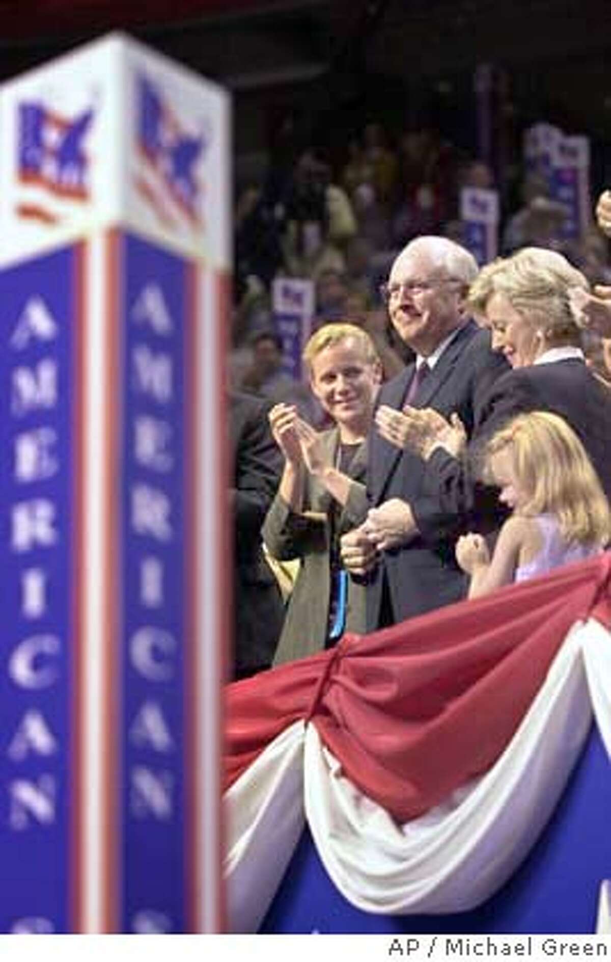 Dick Cheney, the choice of George W. Bush for vice-presidential nominee, attends the Republican National Convention with his family in Philadelphia Monday evening, July 31, 2000. Cheney's daughter, Mary, is at left, wife Lynne at right, and granddaughter at right. (AP Photo/Michael Green) CAT