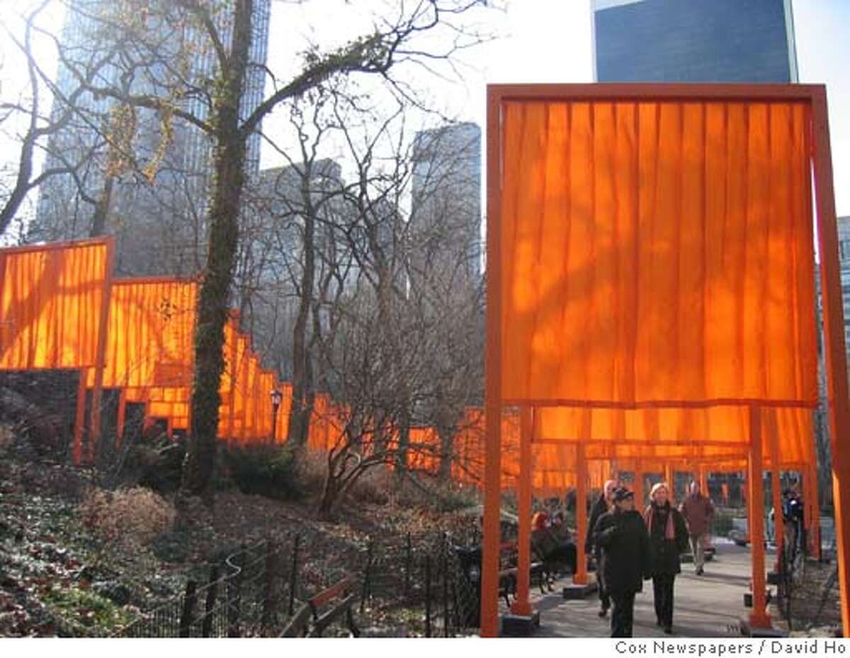 Photo by David Ho/Cox Newspapers slug: COX-NY-CHRISTO13 NEW YORK... 'The Gates, Central Park, New York, 1979-2005' by artists Christo and Jeanne Claude, is displayed along 23 miles of paved paths throughout Central Park, it's the largest public art display in New York City History. 'The Gates', which was unveiled Saturday, Feb. 12, 2005, will be in Central Park until February 27. (Photo by David Ho/Cox Newspapers)