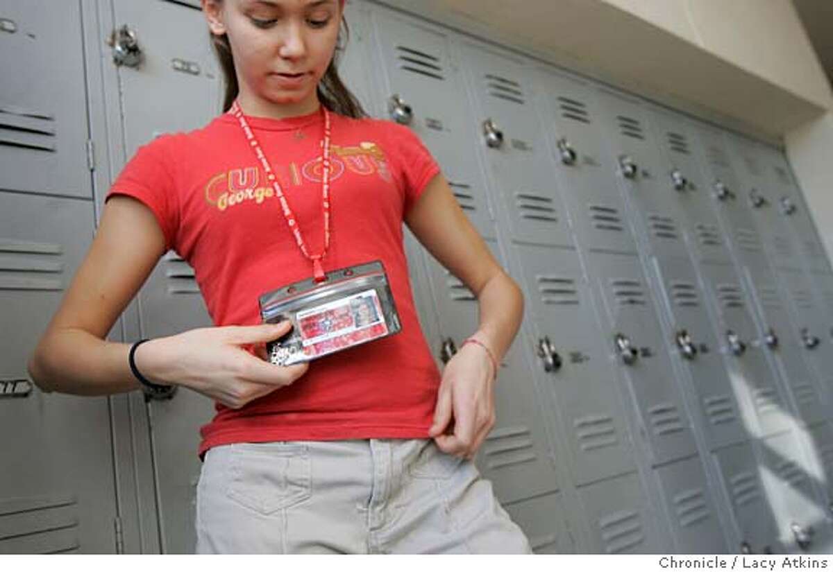 Samantha Seger of the seventh grade shows off her ID badge at the Brittan School, where it's become a controversy among some parents, Tuesday Feb. 8, 2005, in Sutter. Outside the Brittan School where the everyone is made to where ID badges with a tracking device on the back, Tuesday Feb.8, 2005, in Sutter. LACY ATKINS/SAN FRANCISCO CHRONICLE