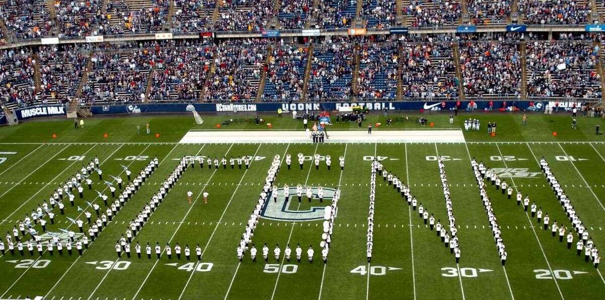 The UConn Marching Band forms the number "6" in the word "UCONN" in honor of Jasper Howard's jersey number during their pregame program before the start of Saturday's contest against Rutgers.
