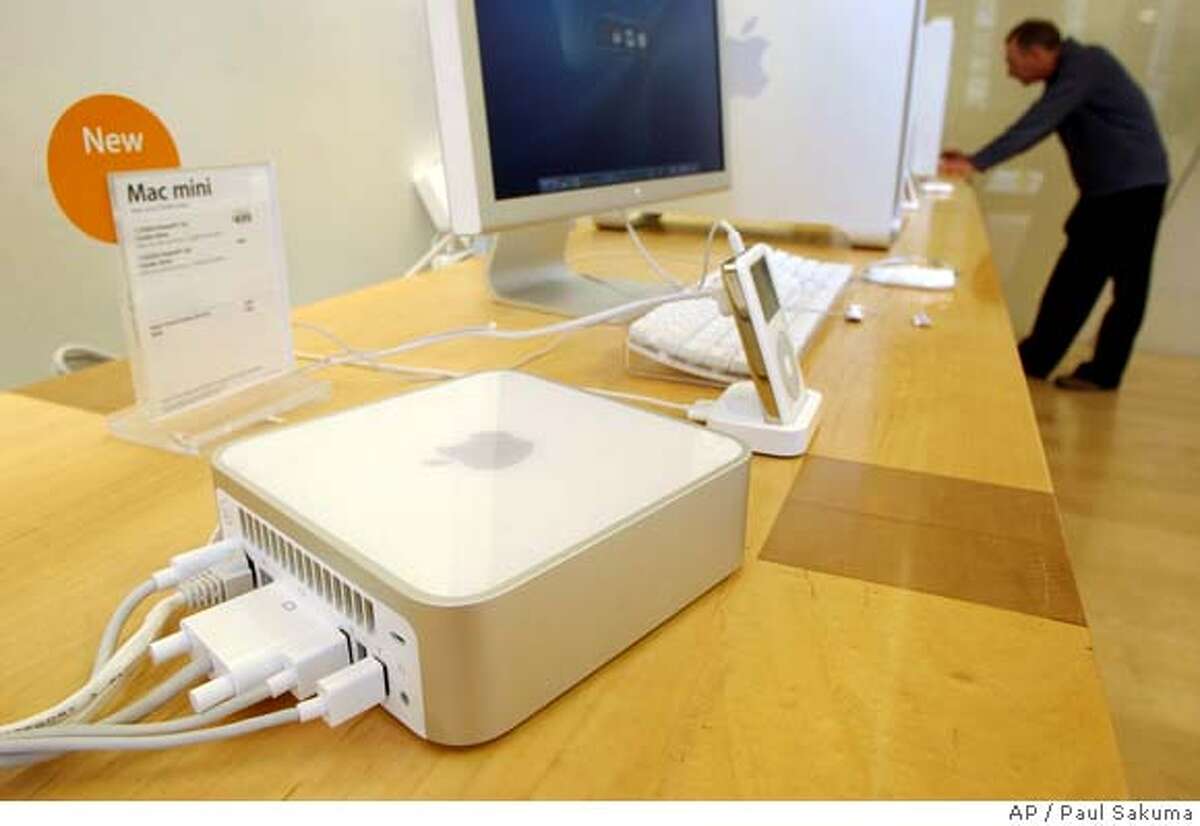 The Apple Computers Inc. new Mac Mini is shown at an Apple store in Palo Alto, Calif., Tuesday, Jan. 25, 2005. As it works to expand its share of the PC market, Mac is shippping a computer tha starts at $499. (AP Photo/Paul Sakuma) HOLD FOR FUTURE USE