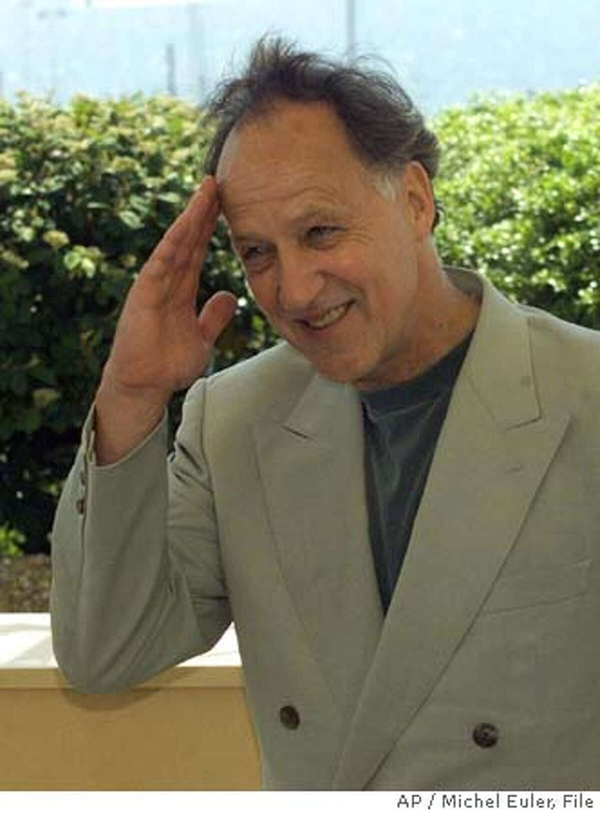 HERZOG-C-12AUG02-DD-AP --- German director Werner Herzog gives a military salute to photographers during a photocall for this film "Mein Liebster Feind" (My Dear Enemy), out of competition, at the 52nd Cannes Film Festival in Cannes, France, Sunday, May 16, 1999.(AP PHOTO/Michel Euler) CAT