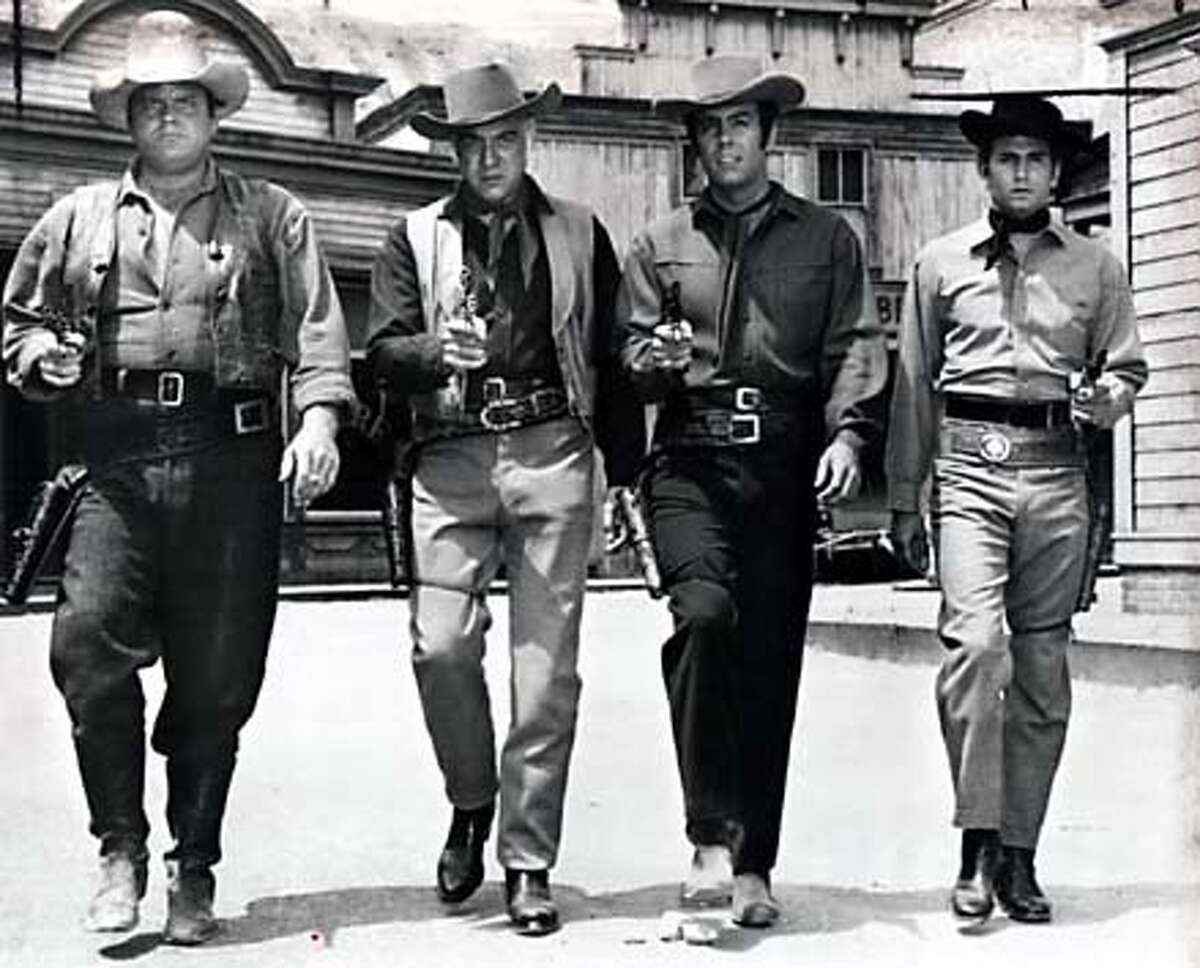 TC08 PHOTO COPYRIGHT 1986 NBC HOSS, BEN, ADAM AND LITTLE JOE CARTWRIGHT ON THE SET OF "BONANZA." THE PONDEROSA RANCH WHERE THE SERIES WAS FILMED HAS BEEN A LONGTIME TOURIST ATTRACTION NEAR INCLINE VILLAGE, NEVADA, BUT IS SHUTTING DOWN AT THE END OF THIS MONTH, AUGUST 2004