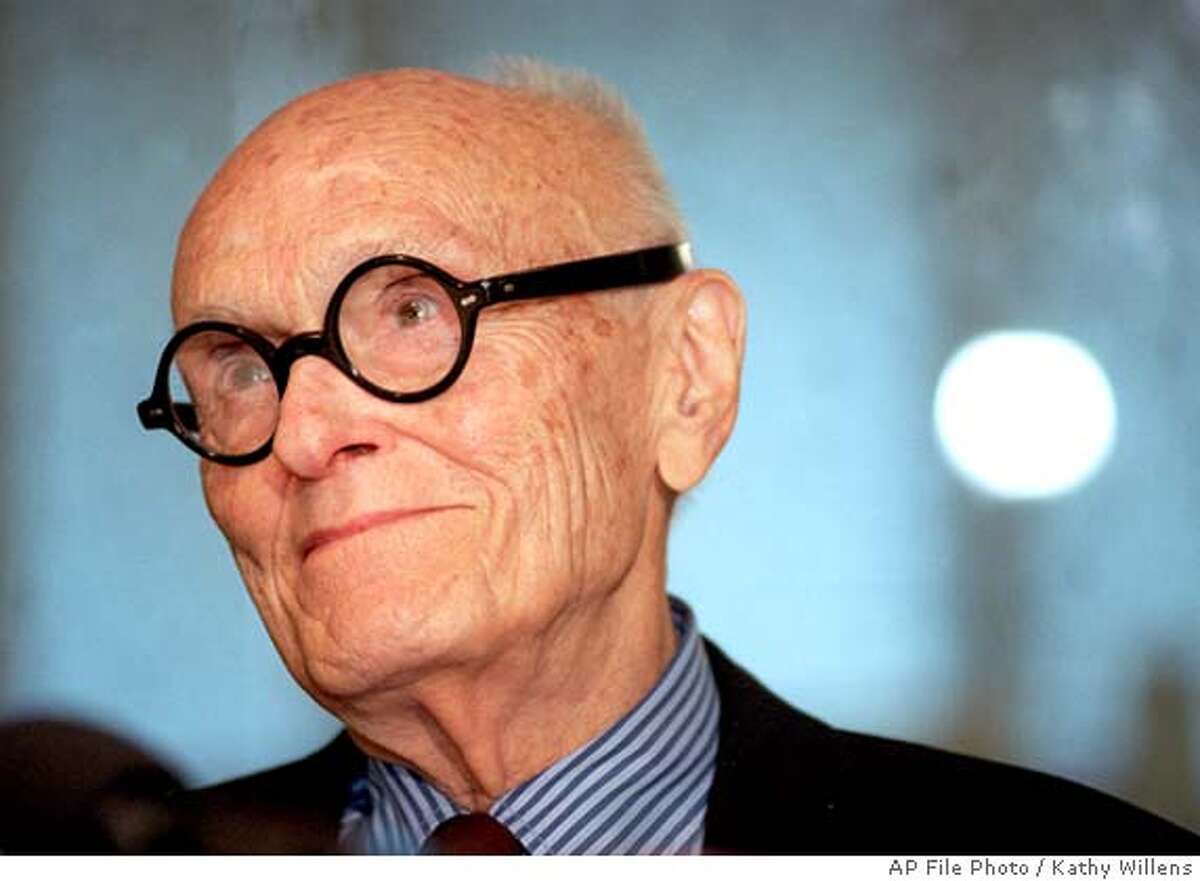 Architect Philip Johnson gives a news conference in New York Monday, July 8, 1996, on his 90th birthday, before unveiling his design for the Cathedral of Hope in Dallas, Texas. Johnson, the innovative architect who promoted the "glass box" skyscraper and then smashed the mold with daringly nostalgic post-modernist designs, has died, a curator at the Museum of Modern Art, said Wednesday, Jan. 26, 2005. He was 98. (AP Photo/Kathy Willens)