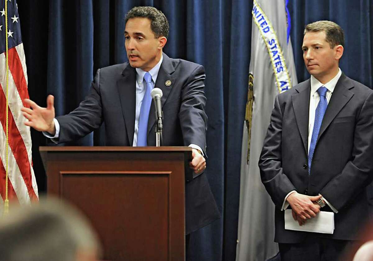 U.S. Attorney Richard Hartunian announces the indictment of Timothy McGinn and David Smith Thursday Jan 26, 2012 at the U.S. District Courthouse in Albany, N.Y. McGinn and Smith are accused by the SEC of defrauding 900 investors of $136 million. Victor Lessoff, Acting Special Agent-in-Charge, IRS, Criminal Investigation, NY Field Office, stands on the right. (Lori Van Buren / Times Union)