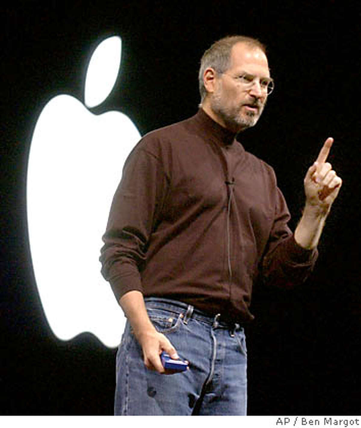 ** FILE ** Apple Computer, Inc., CEO Steve Jobs gestures in this Oct. 16. 2003 file photo, during a media presentation in San Francisco. Jobs, the charismatic chief executive of Apple Computer Inc. and Pixar Animation Studios, said Sunday, Aug. 1, 2004, he had surgery to remove a cancerous tumor from his pancreas but added he expects a full recovery. (AP Photo/Ben Margot, File) OCT. 16, 2003 FILE PHOTO