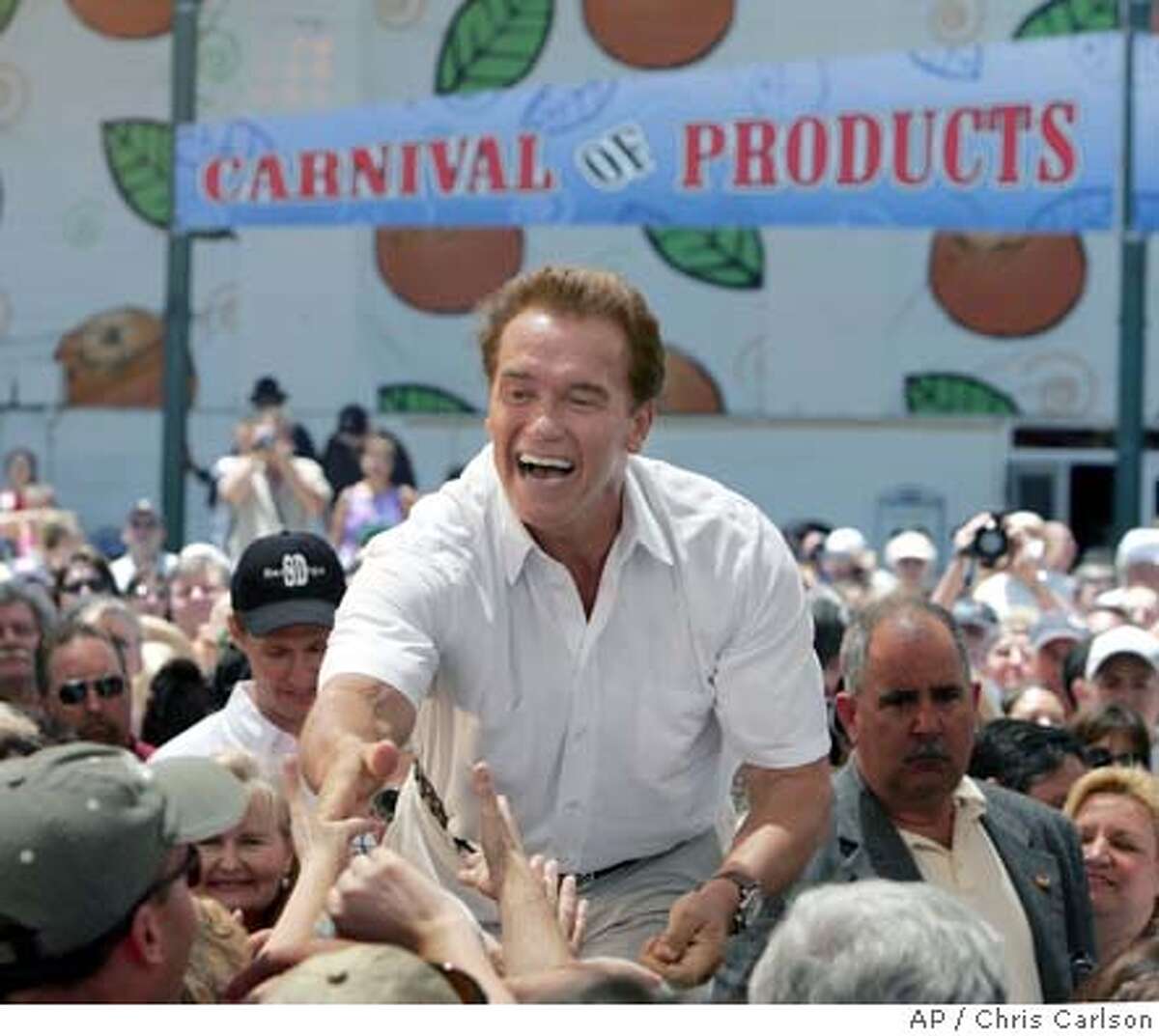 California Gov. Arnold Schwarzenegger thanks supporters for pressing legislators to pass the state budget Friday, July 30, 2004, during a visit to the Orange County Fair in Costa Mesa, Calif. (AP Photo/Chris Carlson)