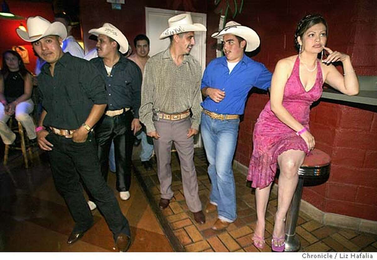 Vita Hernandez (right), 31 years old, of San Jose waits for her boyfriends playing in tonight's band--Los Signos Durangenses at El Rancho restaurant and night club on Monument Blvd. Shot on 7/9/04 in Concord. LIZ HAFALIA / The Chronicle