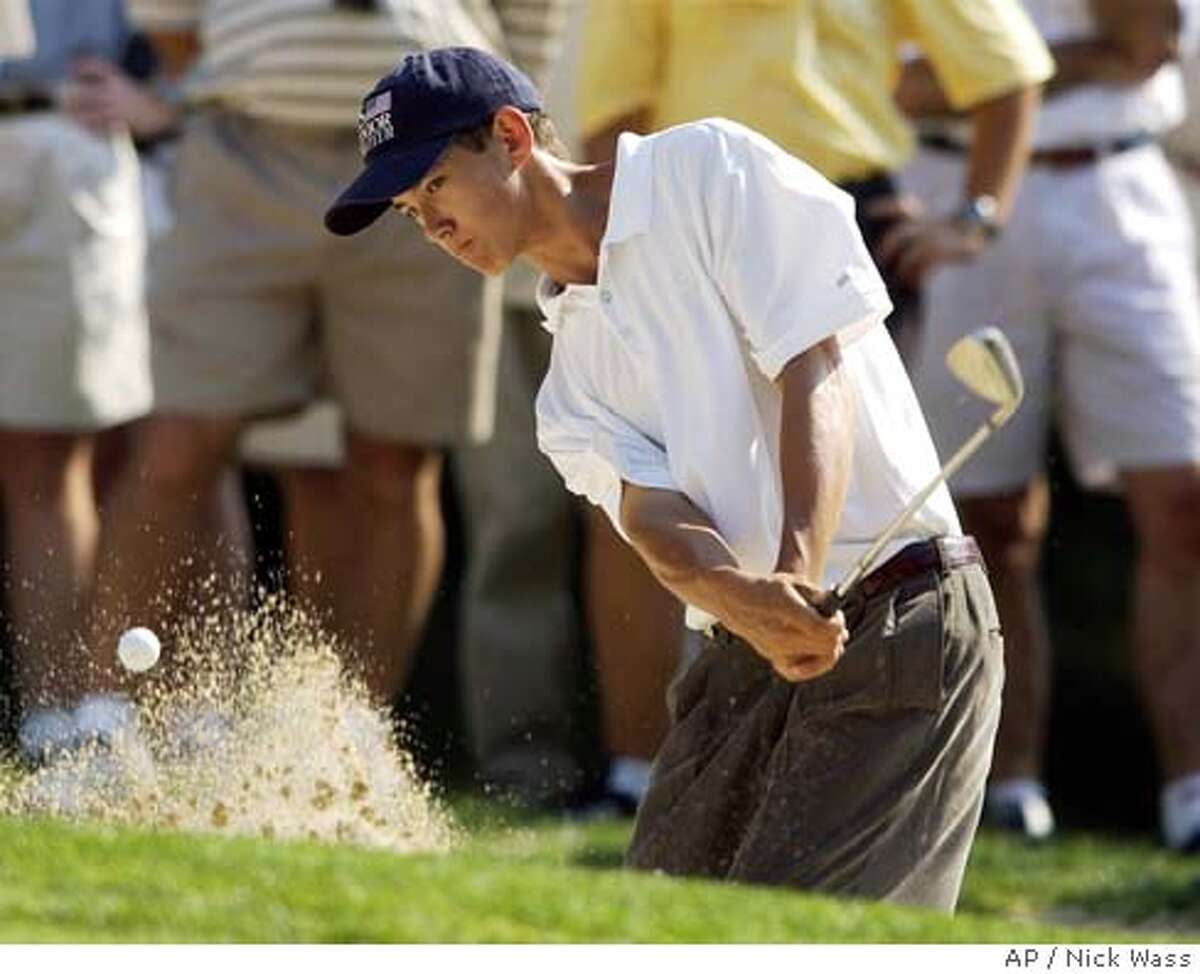 Jordan Cox of Redwood City, Ca. hits out of the sand on the fourth hole during the U.S. Boys' Junior golf championship, Saturday, July 26, 2003, at Columbia Country Club in Chevy Chase, Md. Brian Harman of Savannah, Ga. beat Cox by a score of 5-and-4.(AP Photo/Nick Wass) CAT