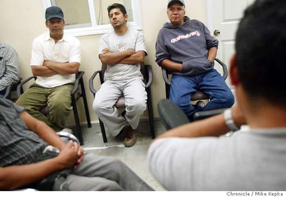 Inside the seemingly calm atmosphere of Concord's new day labor center, Daniel Robles, Jose Figueroa, and Juan Gonzales wait with dozens of other day laborers for a potential job. Day laborers in Concord continue to draw complaints from area residents despite the work being done by Monument Futures Day Labor Center which opened in this past December. MIKE KEPKA/The Chronicle