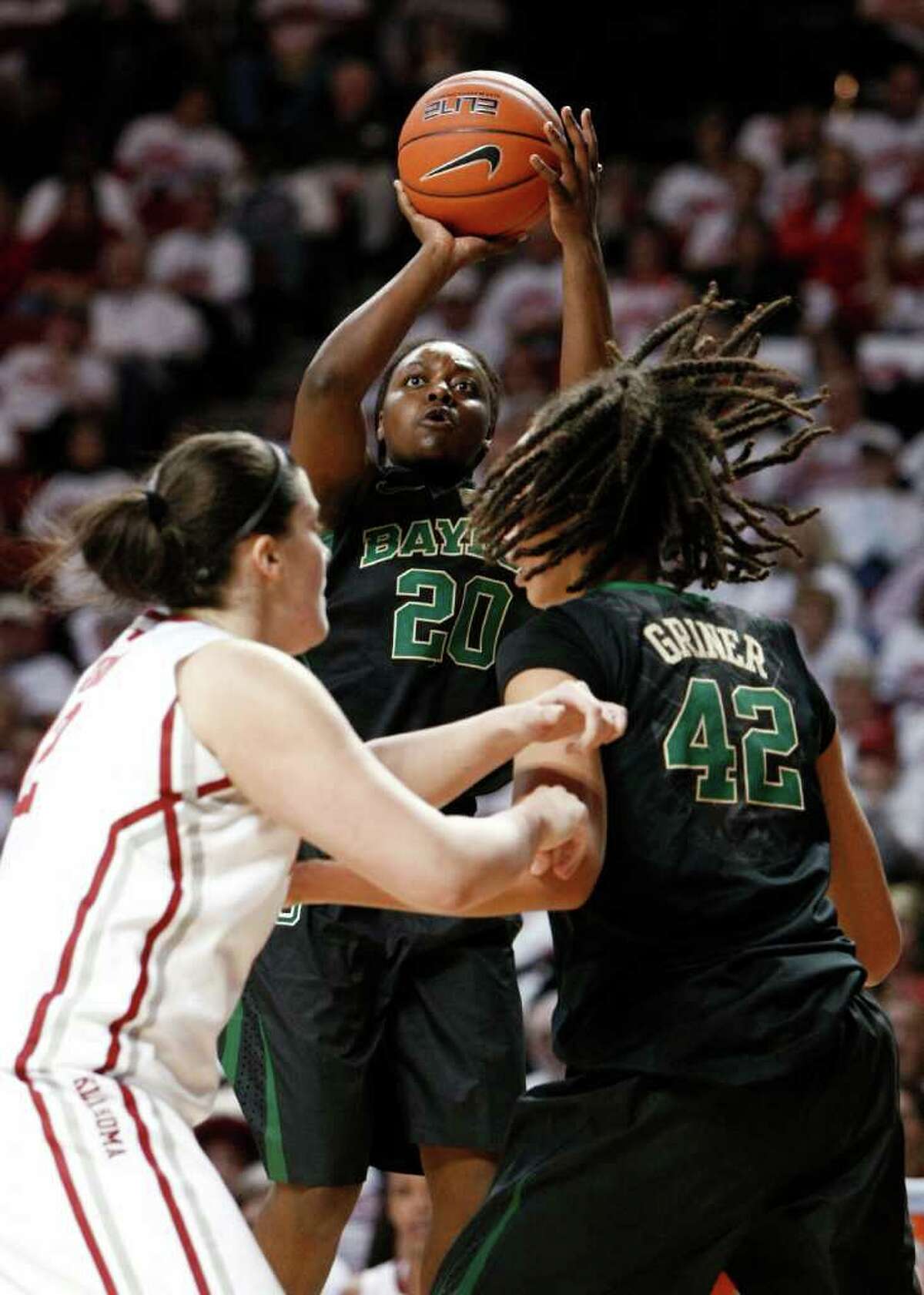 Baylor’s Terran Condrey (middle), who had 14 points, gets room to fire off a jumper in the first half Thursday.