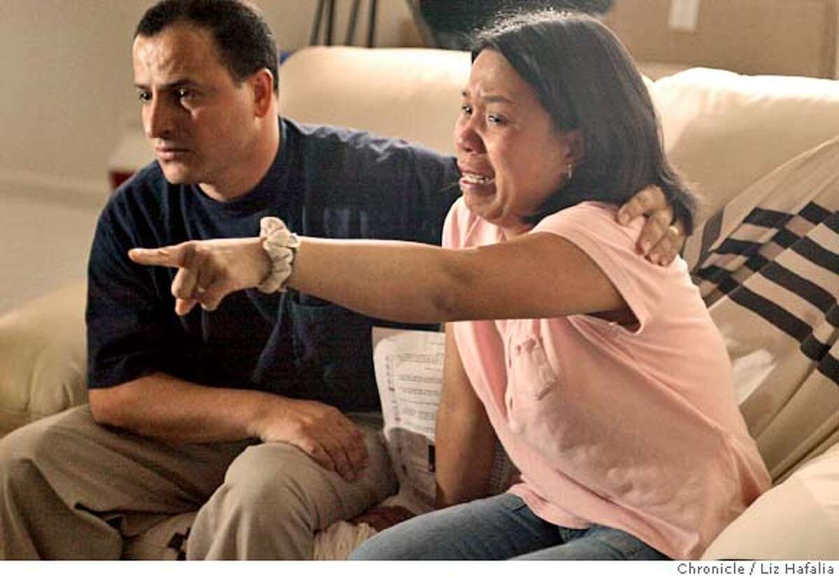 Lydia Dela Cruz Ghazzawi and her husband Khaled Ghazzawi watch the Philippine News as her brother Angelo Dela Cruz was shown. Shot on 7/9/04 in Pacifica. LIZ HAFALIA / The Chronicle