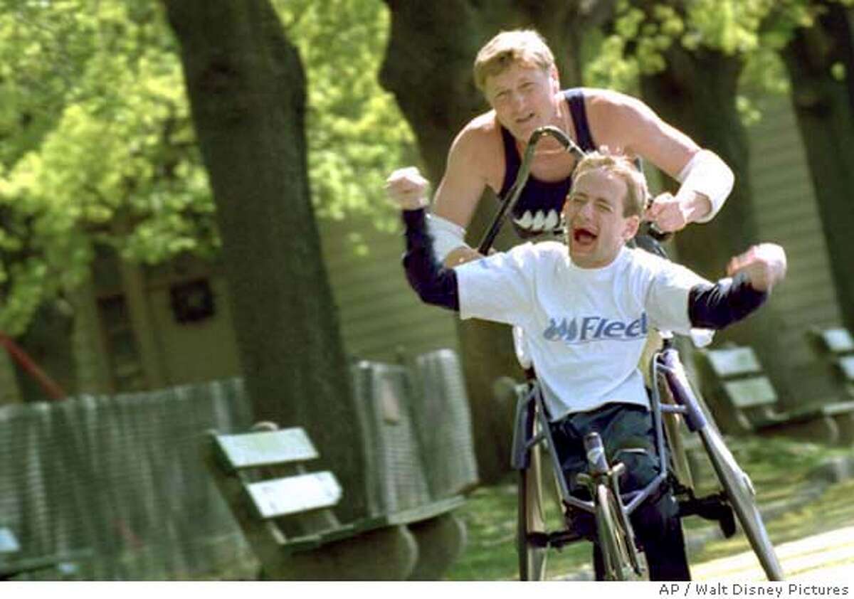 (top to bottom) Dick and Rick Hoyt are featured in Filmmaker Louis Schwartzberg's "America's Heart and Soul," A film that captures ordinary Americans with extraordinary stories. (AP Photo/Walt Disney Pictures )