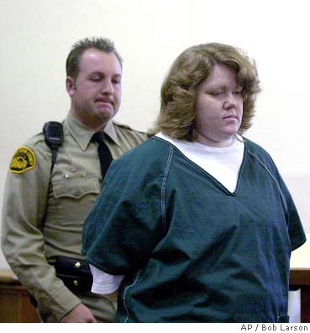 Dawn Godman, 27, is led into court for a preliminary hearing in Martinez, Cailf., Monday Dec. 3, 2001. Godman, Glenn Helzer, 31, his brother, Justin, 29, are accused of going on a killing spree that left five people dead including Selina Bishop, the daughter of blues guitarist Elvin Bishop. (AP Photo/Contra Costa Times, Bob Larson )