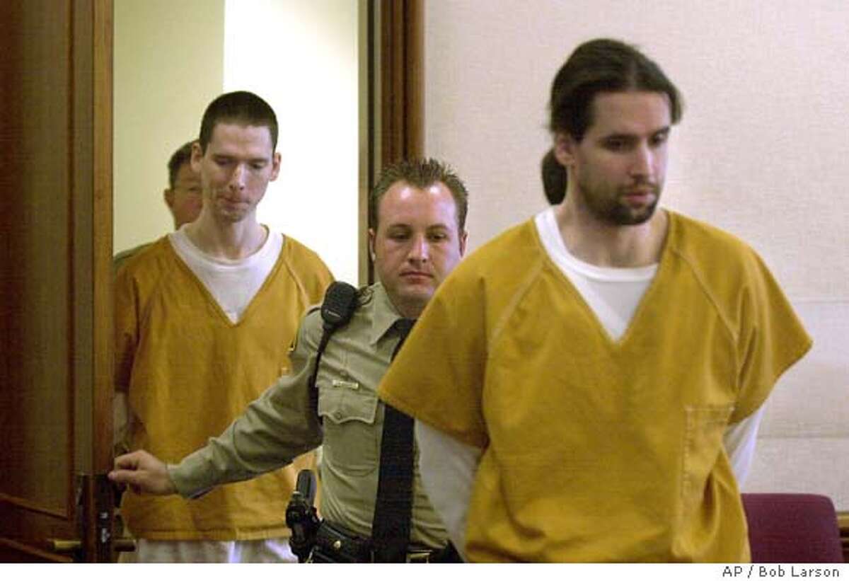 Brothers Justin Helzer, 29, left, and Glenn Helzer, 31, are led into court for a preliminary hearing in Martinez, Cailf., Monday Dec. 3, 2001. The Helzers and their housemate Dawn Godman, 27, are accused of going on a killing spree that left five people dead including Selina Bishop, the daughter of blues guitarist Elvin Bishop. (AP Photo/Contra Costa Times, Bob Larson ) Ran on: 06-10-2004 Carma Helzer leaves the Martinez Courthouse after her sons arraignment.