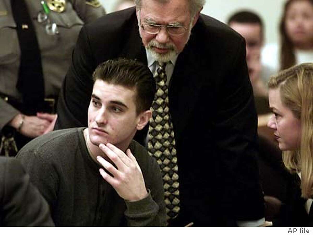 ** FILE ** Jaron Chase Nabors is surrounded by his lawyers during a preliminary hearing in Fremont, Calif., Jan. 29, 2003. Transgender teenager Eddie "Gwen" Araujo died a slow and violent death, according to Nabors who testified Tuesday, April 27, 2004, in a chillingly detailed version of how the 17-year-old was killed. (AP Photo/San Jose Mercury News, Richard Koci Hernandez, File)