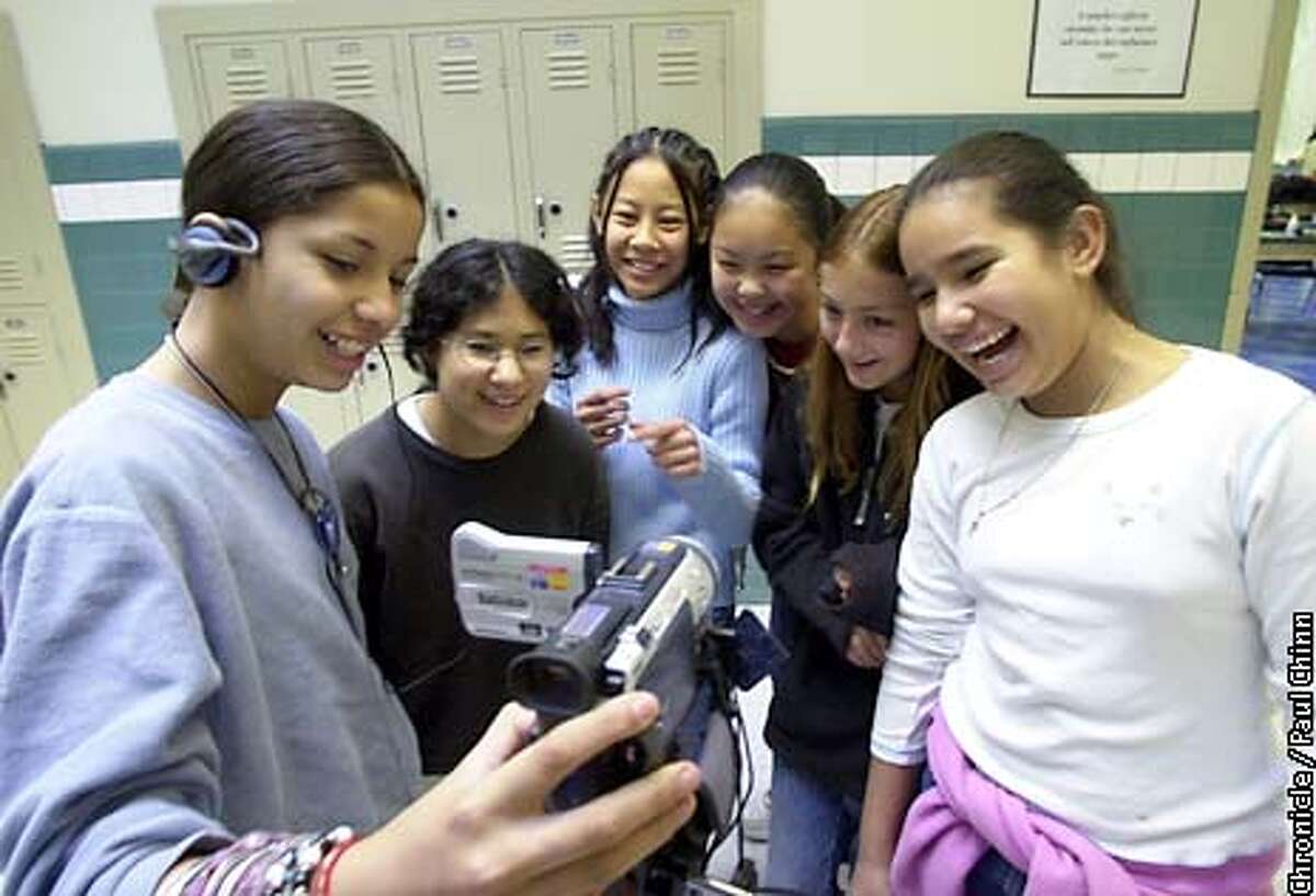 From left, Kenia Lacayo, Aisha DeAvila-Shin, Kieu Tran, Pauline Ng, Laurel Picklum, and Lizette Alonso taped a scene for their video production. Oakland teacher Anthony Cody is concerned that his Tech Bridge class for girls will be slashed from next year's budget. PAUL CHINN/S.F. CHRONICLE