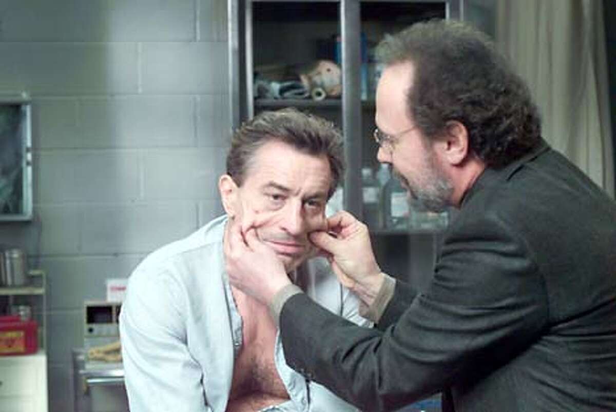 Psychotherapist Ben Sobel (Billy Crystal, right) tries to coax mob boss Paul Vitti (Robert De Niro) out of his jailhouse stupor in "Analyze That."