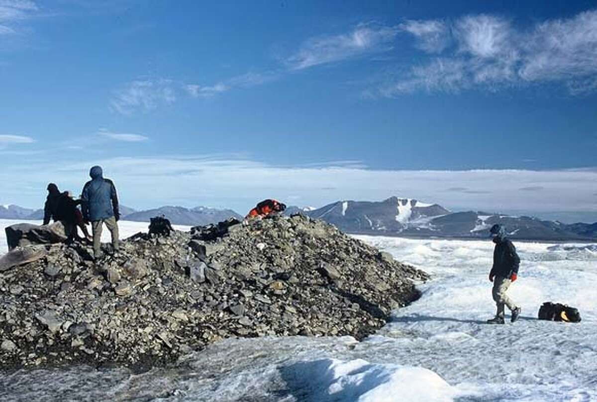 This photo is from a 6-person expedition team in July 2003 that is believed to be first humans to set foot on the northernmost land on Earth, a small island about 140 feet long off the northern tip of Greenland and 432 miles from the North Pole.