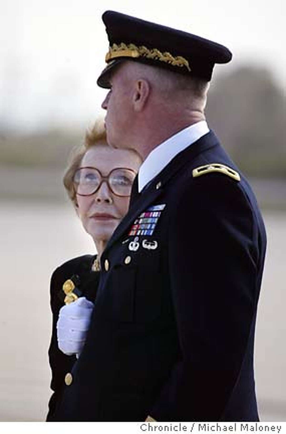 Former First Lady Nancy Reagan and Maj. Gen. Galen B. Jackman, Commanding General, US Army Military District of Washington, Washington, DC. wait as the casket is removed from the hearse. The casket of former President Ronald Reagan along with his family departed Naval Base Ventura County in Point Mugu on a presidential aircraft, enroute to Andrews Air Force Base near Washington DC. After lying in state at the Capitol Rotunda and a national and state funeral ceremonies, the casket will be flown back to the Presidential Library in Simi Valley, CA for burial on Friday. Photo by Michael Maloney / San Francisco Chronicle