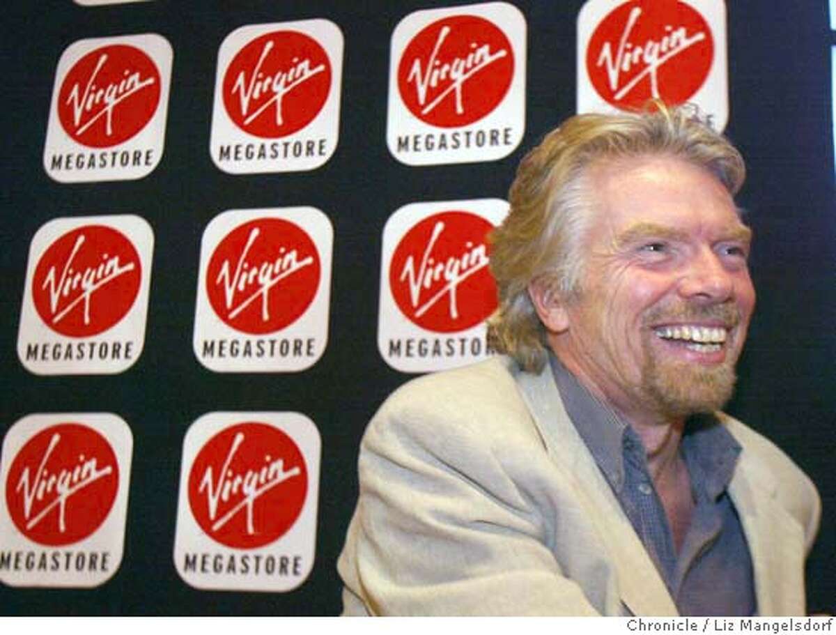 46FB0038.JPG virgin entertainment CEO Richard branson during a press conference at the SF Virgin Megastore. He is promoting two new technologies and other store features designed to lure buyers back to the store. Event on 12/3/03 in San Francisco. LIZ MANGELSDORF / The Chronicle ALSO RAN 01/17/04(3S) also ran 01/11/2004 Richard Branson, chief executive officer of Virgin Entertainment, discusses a new approach taken at the San Francisco megastore. Richard Branson, chief executive officer of Virgin Entertainment, discusses a new approach taken at the San Francisco megastore. MANDATORY CREDIT FOR PHOTOG AND SF CHRONICLE/ -MAGS OUT Richard Branson, chief executive officer of Virgin Entertainment, is trying to make it easier for buyers to sample CDs in the store. Virgin Atlantic is seeking to lure high-end business passengers with its Upper Class suite, above, and bar, below. Richard Branson Gov. Arnold Schwarzenegger, right, is lobbying Virgin Atlantic's Richard Branson. CAT Nation#MainNews#Chronicle#12/5/2003#ALL#3star##0421513951