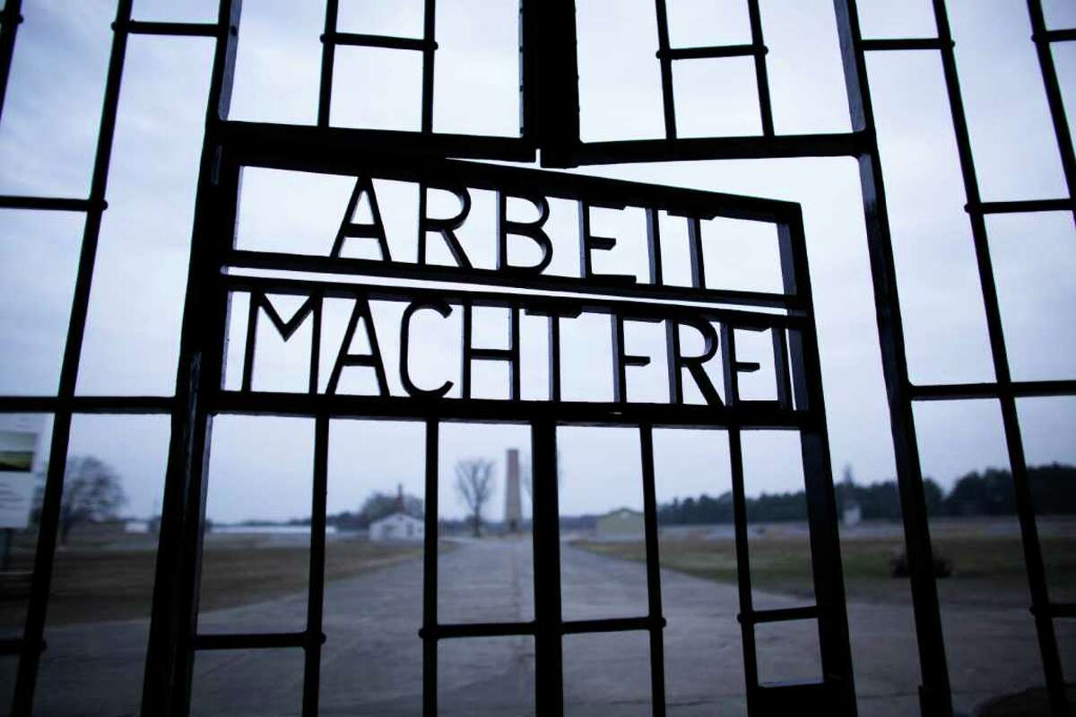 The slogan 'Arbeit Macht Frei' (Work Sets you Free) at the main entrance of the Sachsenhausen Nazi death camp on the international Holocaust remembrance day in Oranienburg, Germany, on Friday. The remembrance day marks the day of the liberation of the Auschwitz-Birkenau death camp 67-years ago.