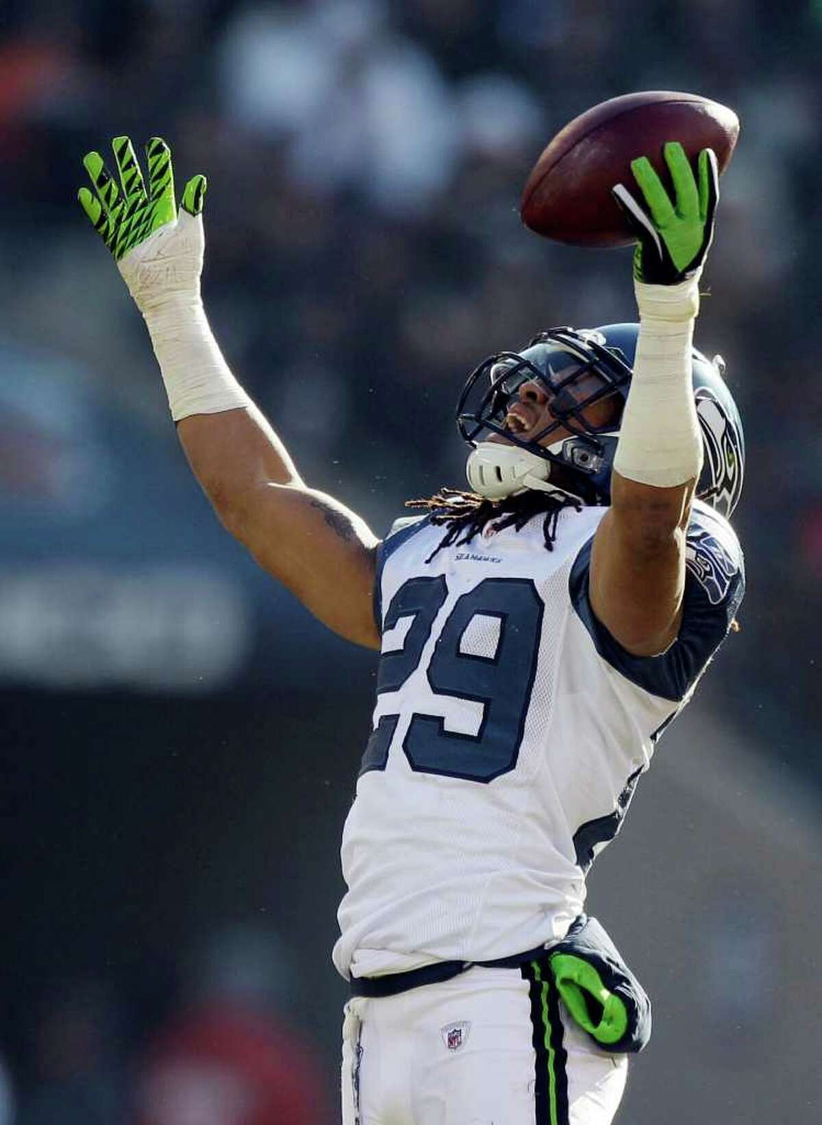Seattle Seahawks safety Earl Thomas (29) reacts after recovering a fumble by Chicago Bears wide receiver Johnny Knox (13) in the first half of an NFL football game in Chicago, Sunday, Dec. 18, 2011. Knox was injured on the play. (AP Photo/Nam Y. Huh)