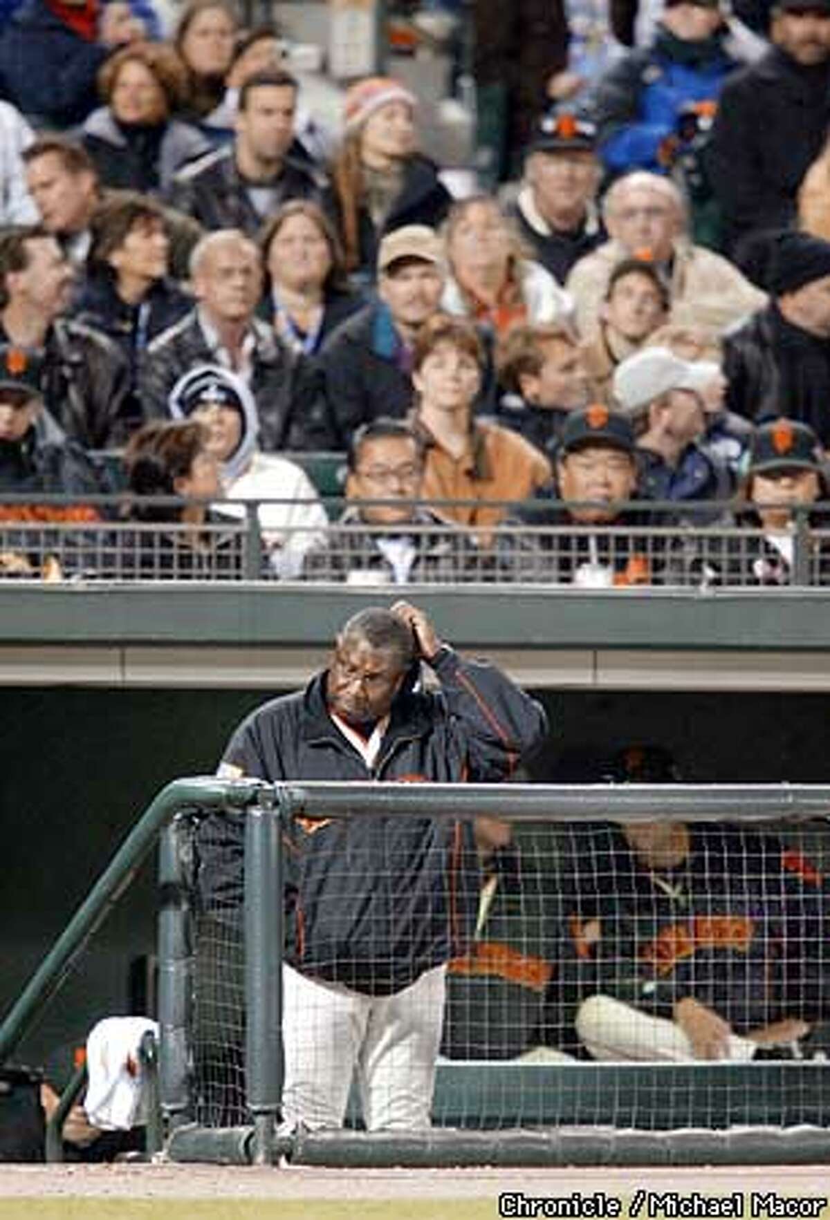 .jpg---Giants manager Dusty Baker scratches head as the Giants our down to their last out in the ninth inning. The San Francisco Giants play the Anaheim Angels in Game 3 of the World Series at Pac Bell Park in San Francisco, Ca., October 22, 2002. Michael Macor/San Francisco Chronicle