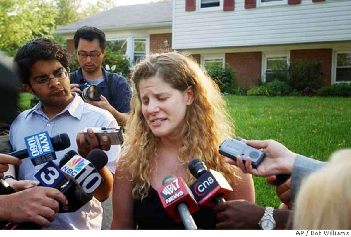 Sara Berg, sister of Nicholas Berg, speaks to reporters Wednesday, May 12, 2004, near West Chester, Pa., and begs media members not to try to attend either the funeral or memorial service for her brother. Nicholas Berg was beheaded in Iraq; his body arrived in the United States on Wednesday. (AP Photo/Philadelphia Inquirer, Bob Williams) -PHIX TV OUT MAGS OUT